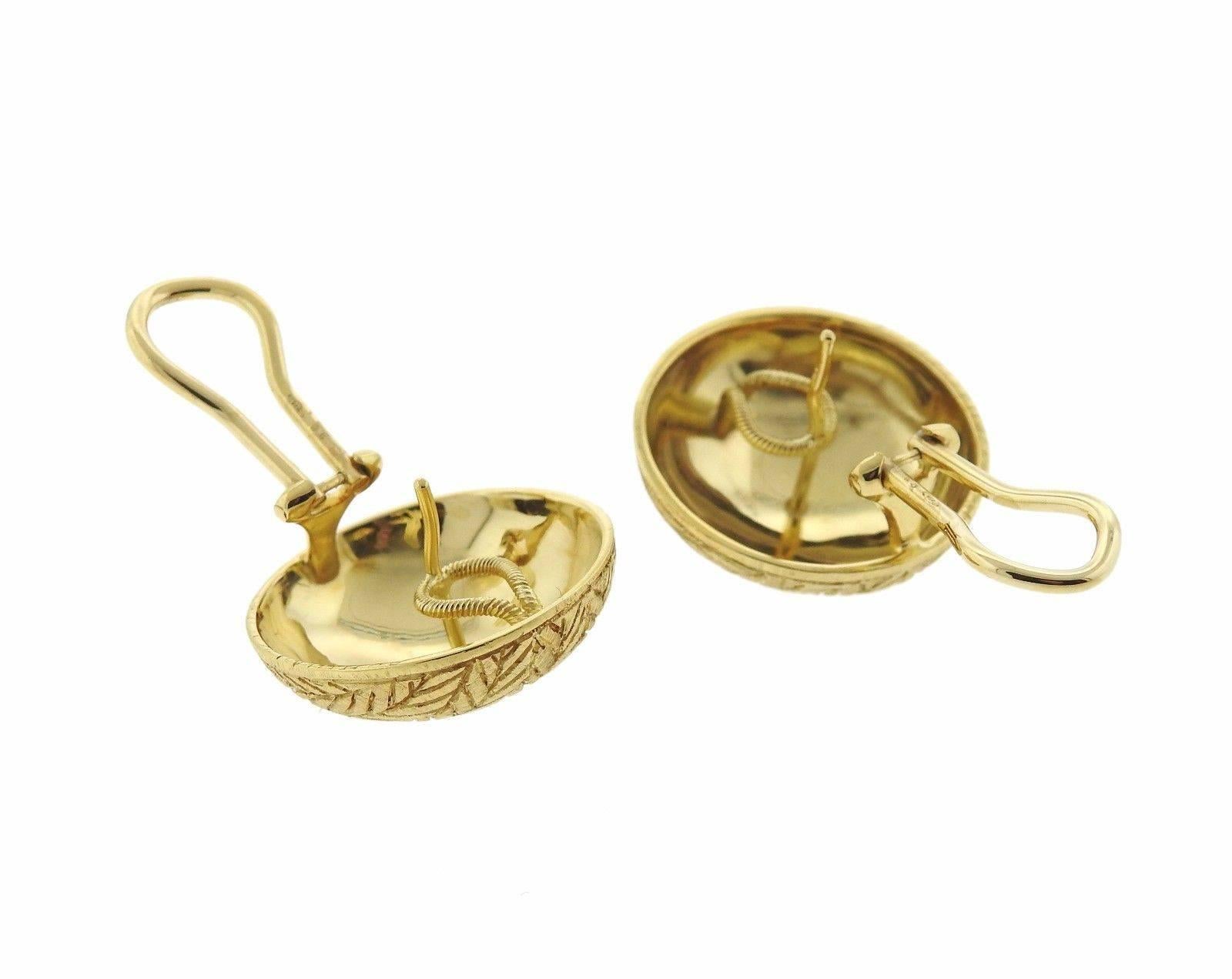 A pair of 18k gold button earrings.  The earrings measure 21.3mm in diameter and weigh 15 grams.  Marked: Buccellati 18KT Italy.  The current retail is $5110.