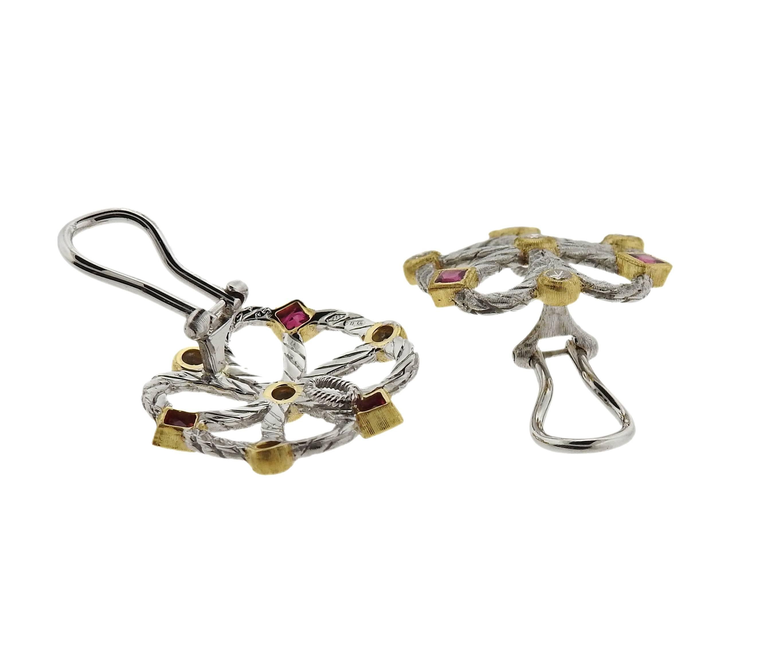 Buccellati 18K Gold earrings decorated with rubies and diamonds. Earrings measure 21mm x 21mm. Marked: Buccellati, 18K, Italy. Weight: 11.1 grams. Earrings come with Buccellati paperwork. Retail $10,030.