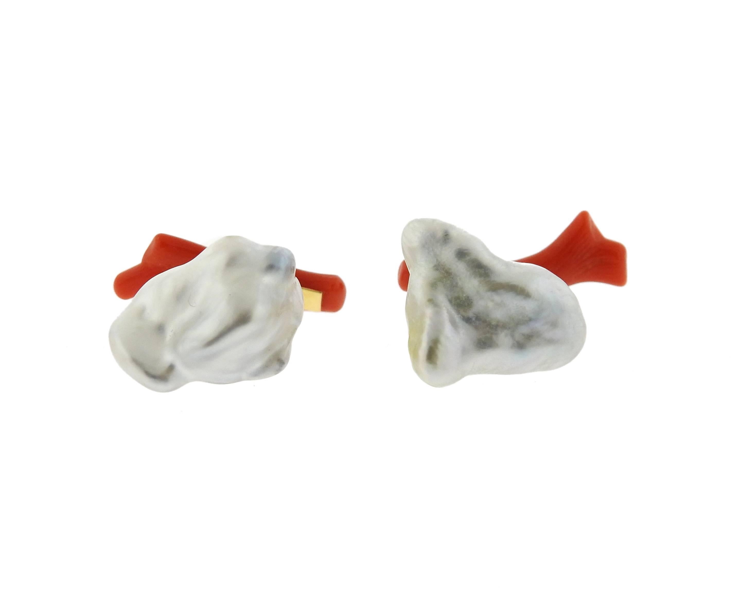 18K Gold Trianon cufflinks feature pearls and coral. Pearl tops measure 16mm x 11mm. Coral measure 21mm x 6mm. Marked: 2008, 1998, Trianon Mark, 750. Weight: 5.8 grams. 