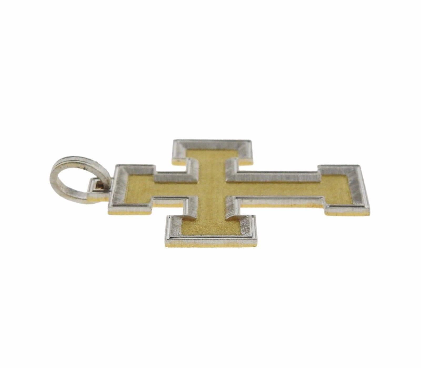 An 18k yellow and white gold large cross pendant.  The pendant measures 44mm (excluding bale) x 35mm and weighs 15.6 grams. Marked: Gianmaria Buccellati 18K Italy.  Comes with Buccelalti paperwork.  The current retail is $9540.