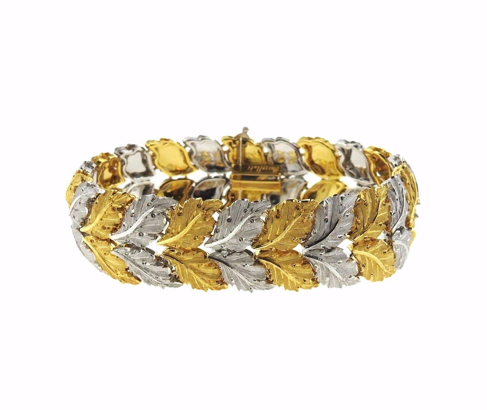 An 18k gold bracelet depicting leaves.  The bracelet measures 7