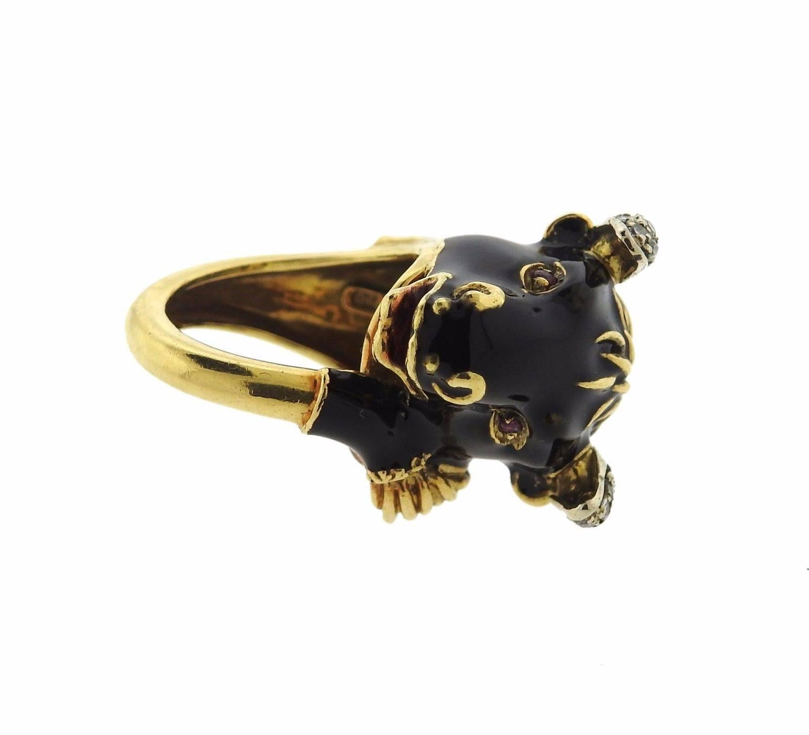 An 18k gold ring coated with black enamel and set with approximately 0.10ctw of H/SI diamonds.  The ring is a size 6 and the top of the ring is 20mm wide.  The ring sits 15mm from the finger.  The weight of the piece is 17.1 grams.  Marked: Modele