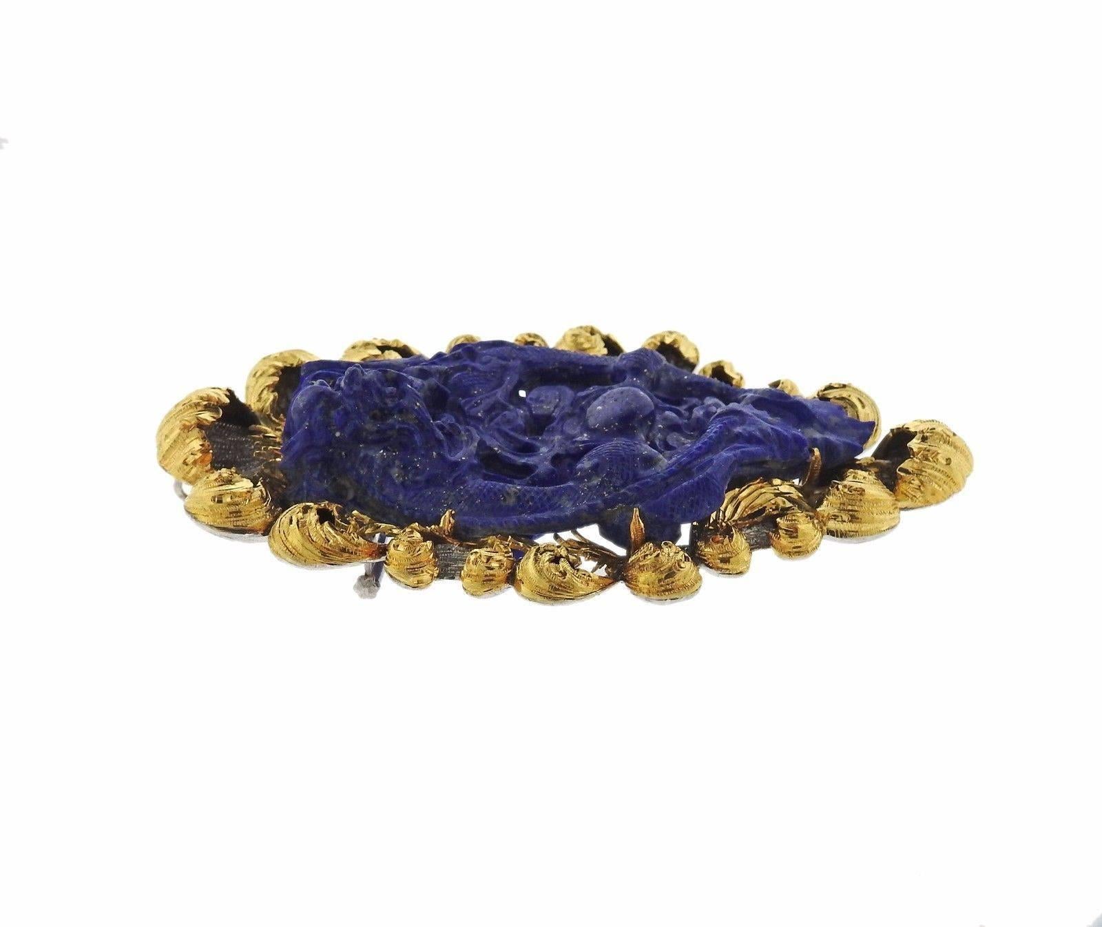 An 18k gold brooch set with caved lapis.  The brooch measures 95mm x 62mm and weighs 83.0 grams.  Marked: Buccellati 18K Italy.  Comes with Buccellati paperwork.  Current retail is $27,340.