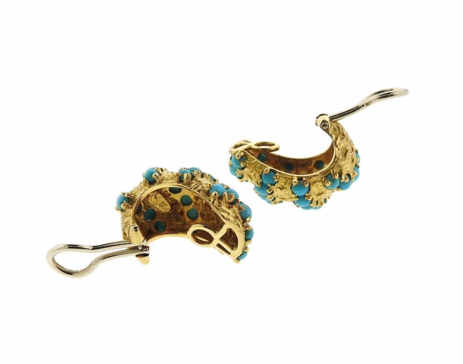 A pair of 18k gold earrings set with turquoise.  The earrings are 24mm x 17mm and weigh 17.8 grams.  Marked: 469MI, 750.