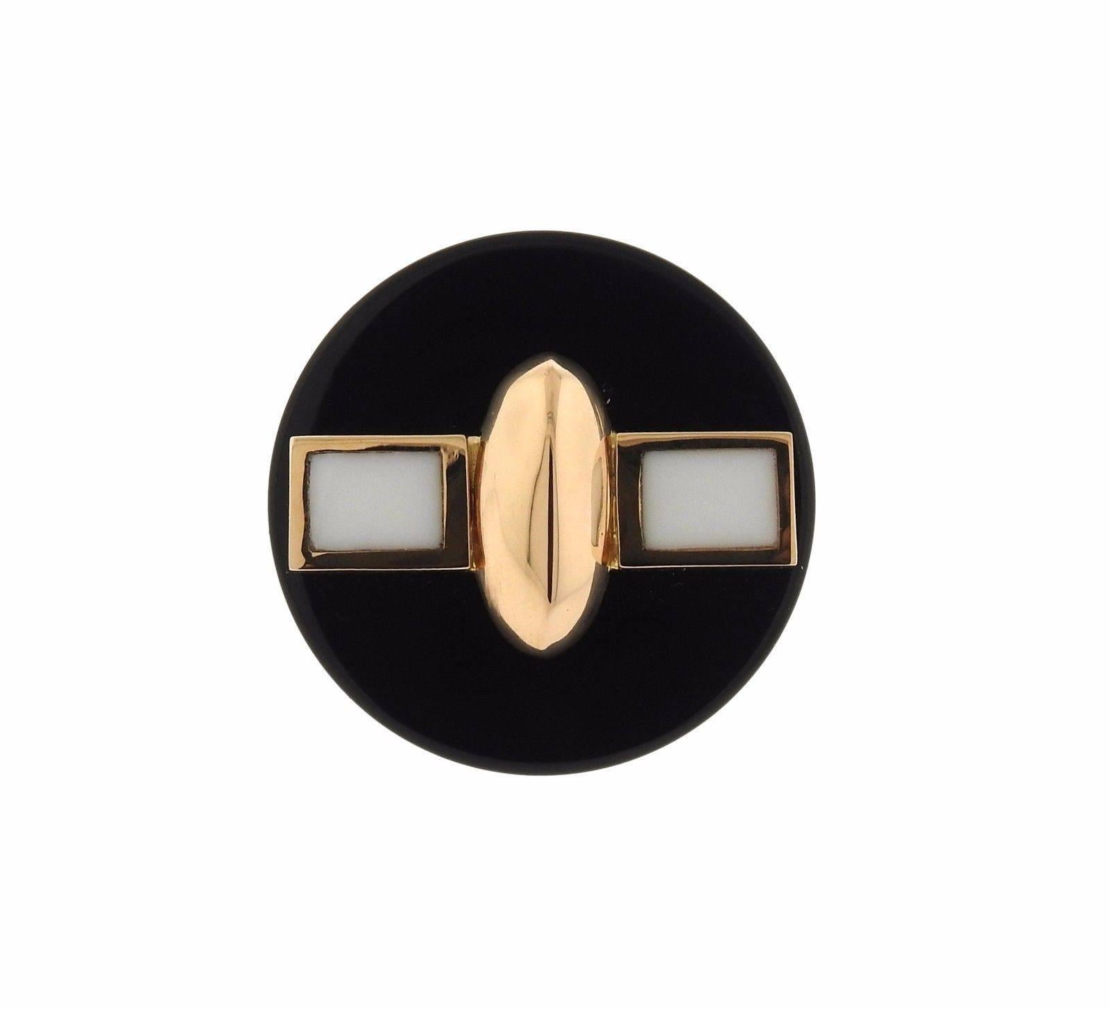 An 18k gold ring set with onyx.  The ring is a size 7.5 with the top measuring 37mm in diameter and sitting 16mm from the finger.  The weight of the piece is 33.9 grams. Marked: 750, G. Facchini.