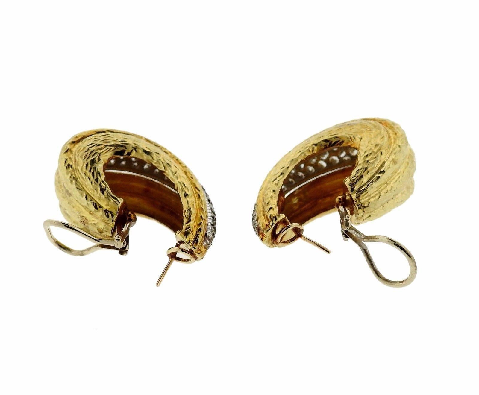 A pair of 14k yellow gold earrings set with approximately 5 carats of GH/VS diamonds.  The earrings measure 37mm x 16mm and weigh 40.8 grams.