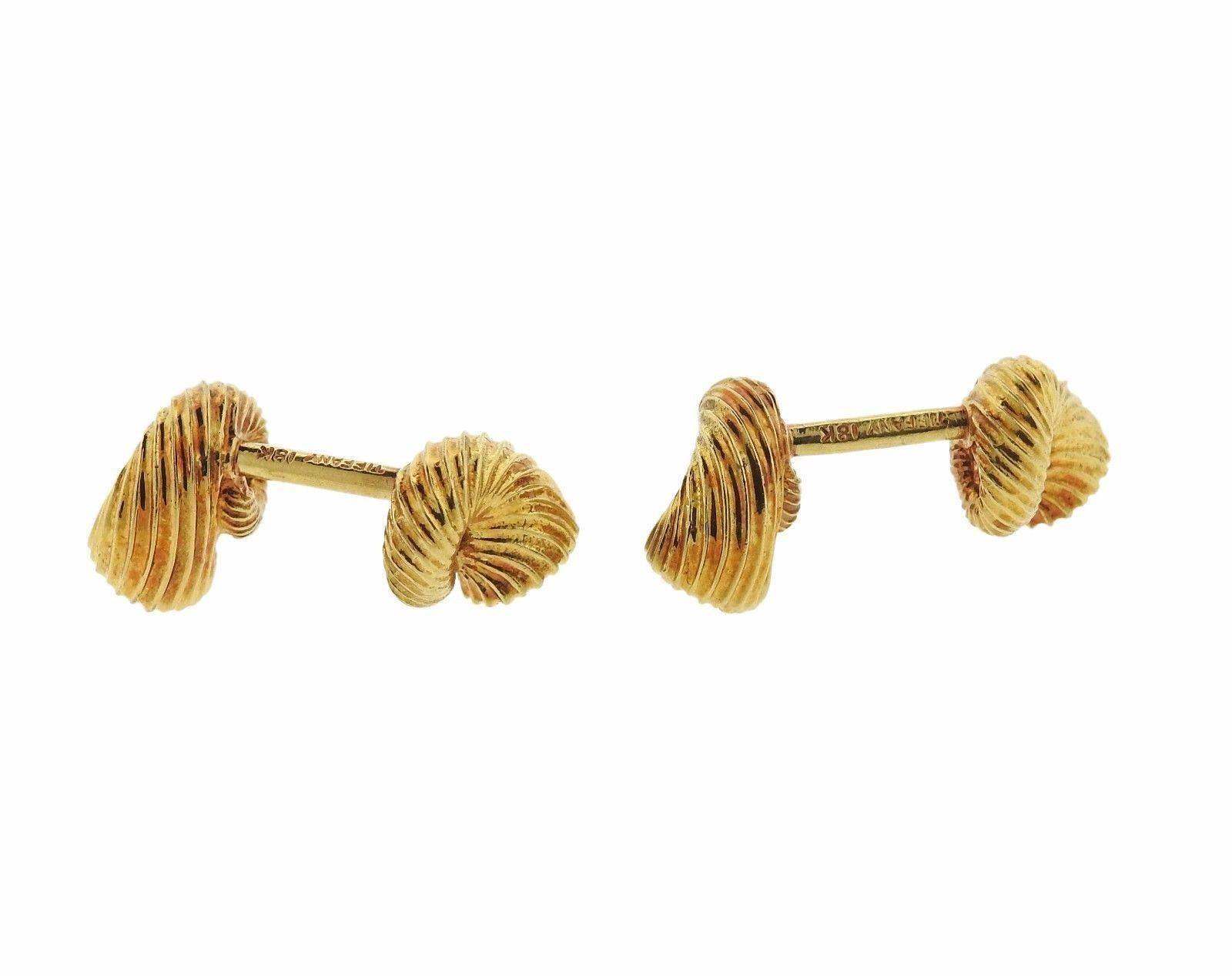 A pair of 18k yellow gold cufflinks set with approximately 0.32ctw of G/VS diamonds.  The cufflinks measure 12mm x 8mm and weigh 17.1 grams.  Marked: Schlumberger, Tiffany, 18k.  The weight of the pair is 17.1 grams.