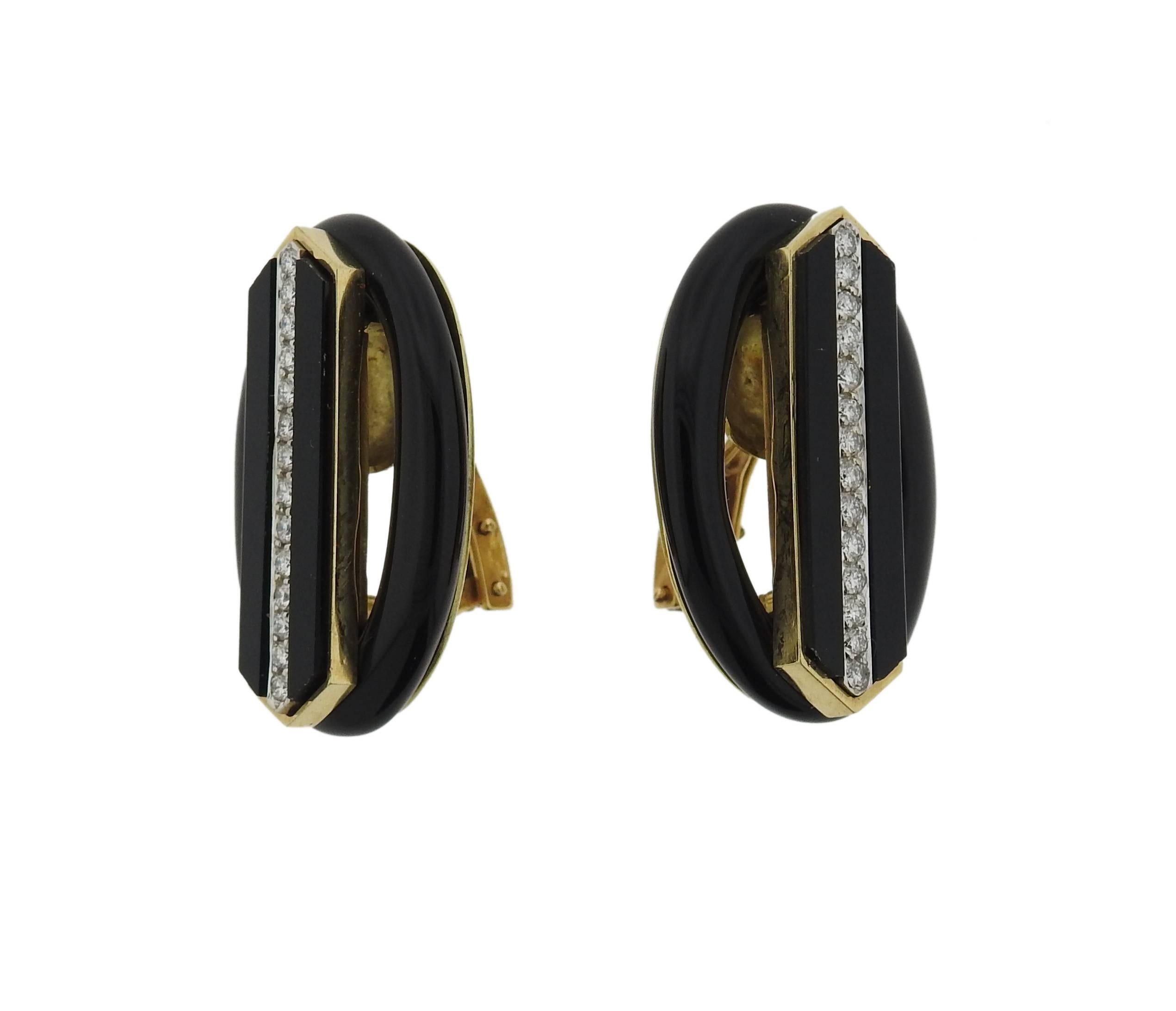 18k gold oval earrings, decorated with black onyx and approximately 0.40ctw  in VS-SI/H diamonds.  Earrings measure 30mm x 20mm. Marked: 18k EMIS. Weight: 20.8 grams