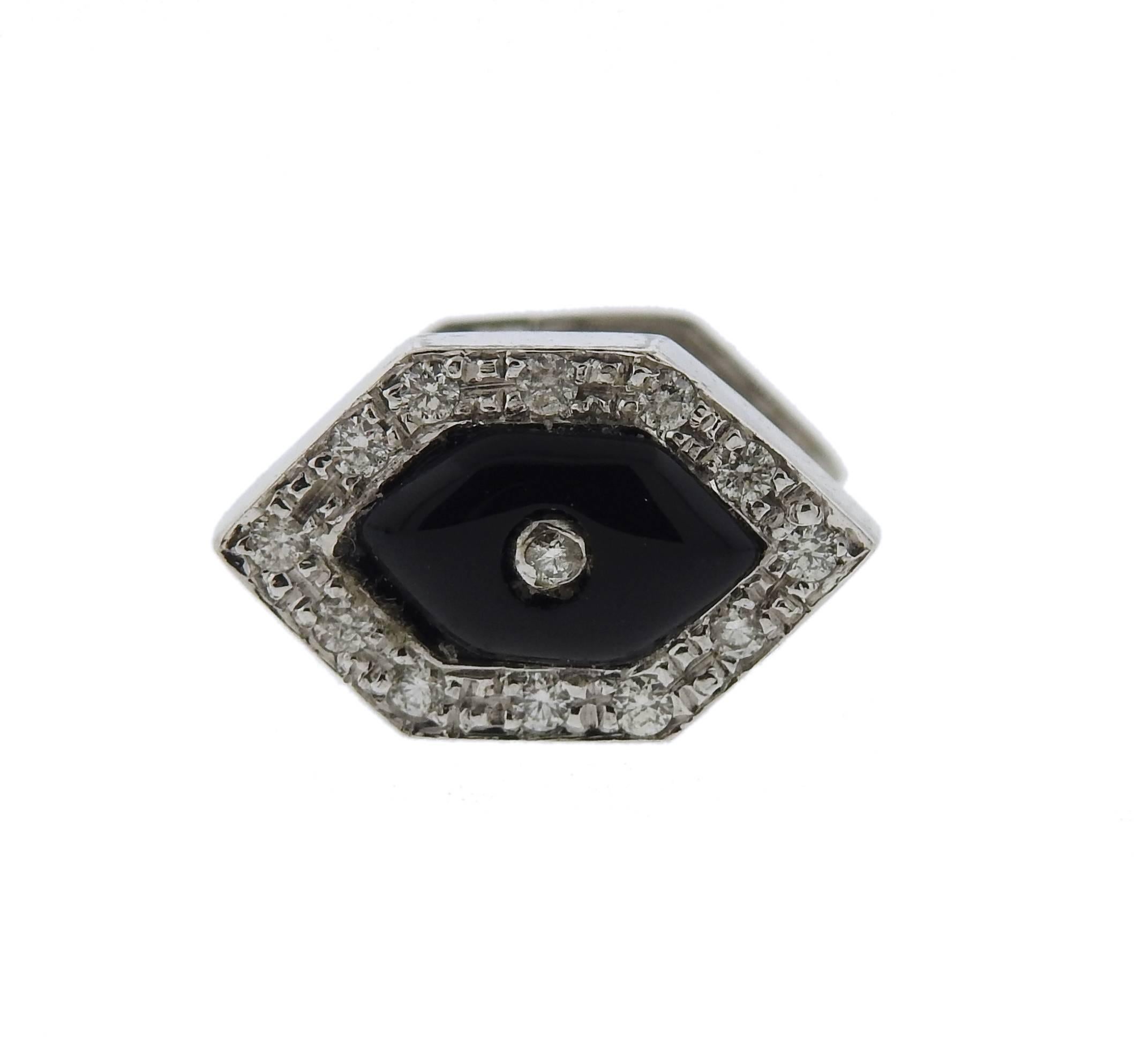 An 18k white gold cufflinks and studs set, crafted by N. Breen & Co, decorated with approx. 1.10ctw in diamonds and onyx. Cufflink top measures 18mm x 12mm, stud top - 13mm x 8mm. Marked: N. Breen & Co, 18k. Weight - 22.7 grams 