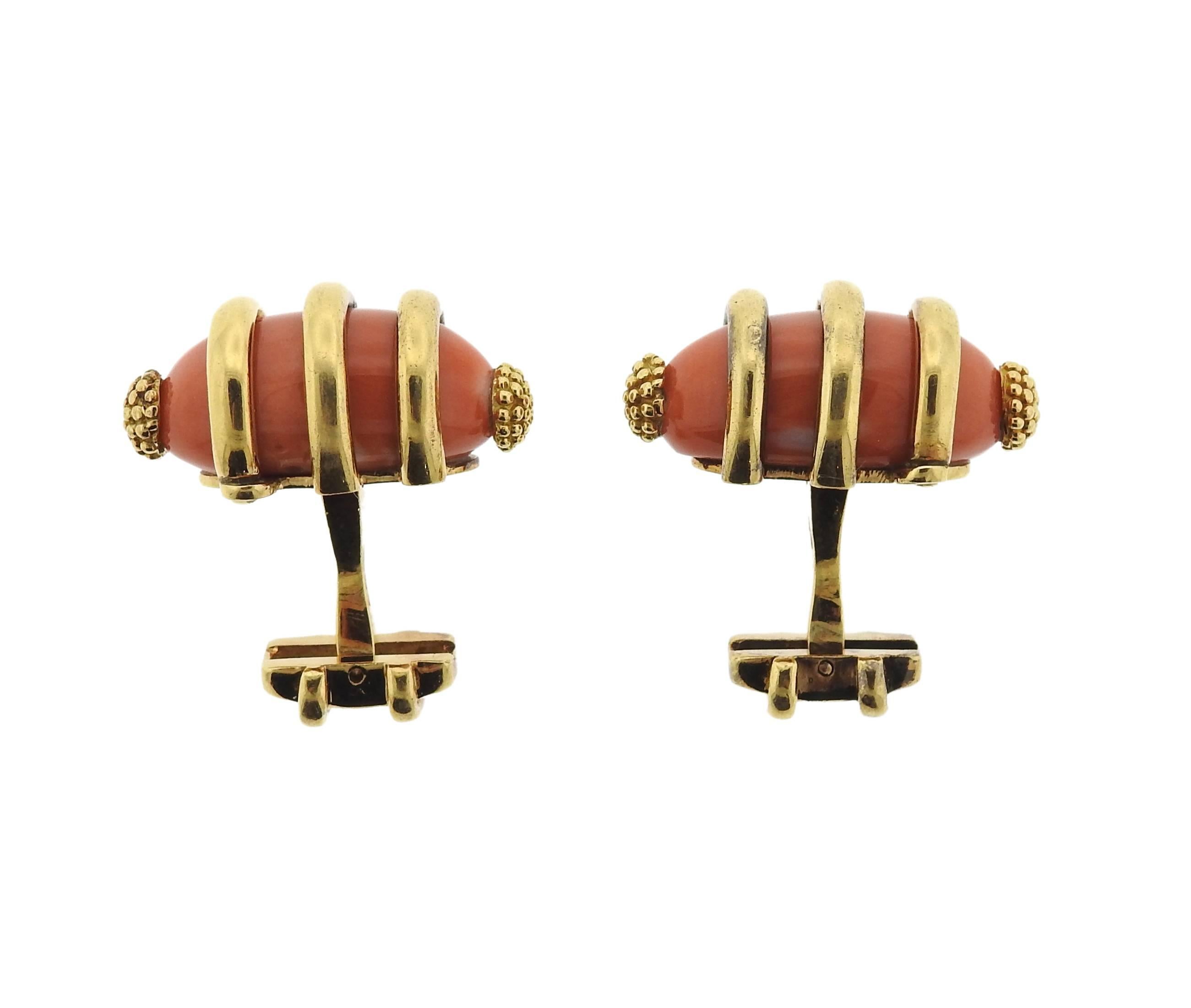 A pair of massive 18k yellow gold cufflinks, crafted in France, set with coral stones. Cufflink top measures 26mm x 17mm . Marked: French gold assay marks . Weight: 37.3 grams 
