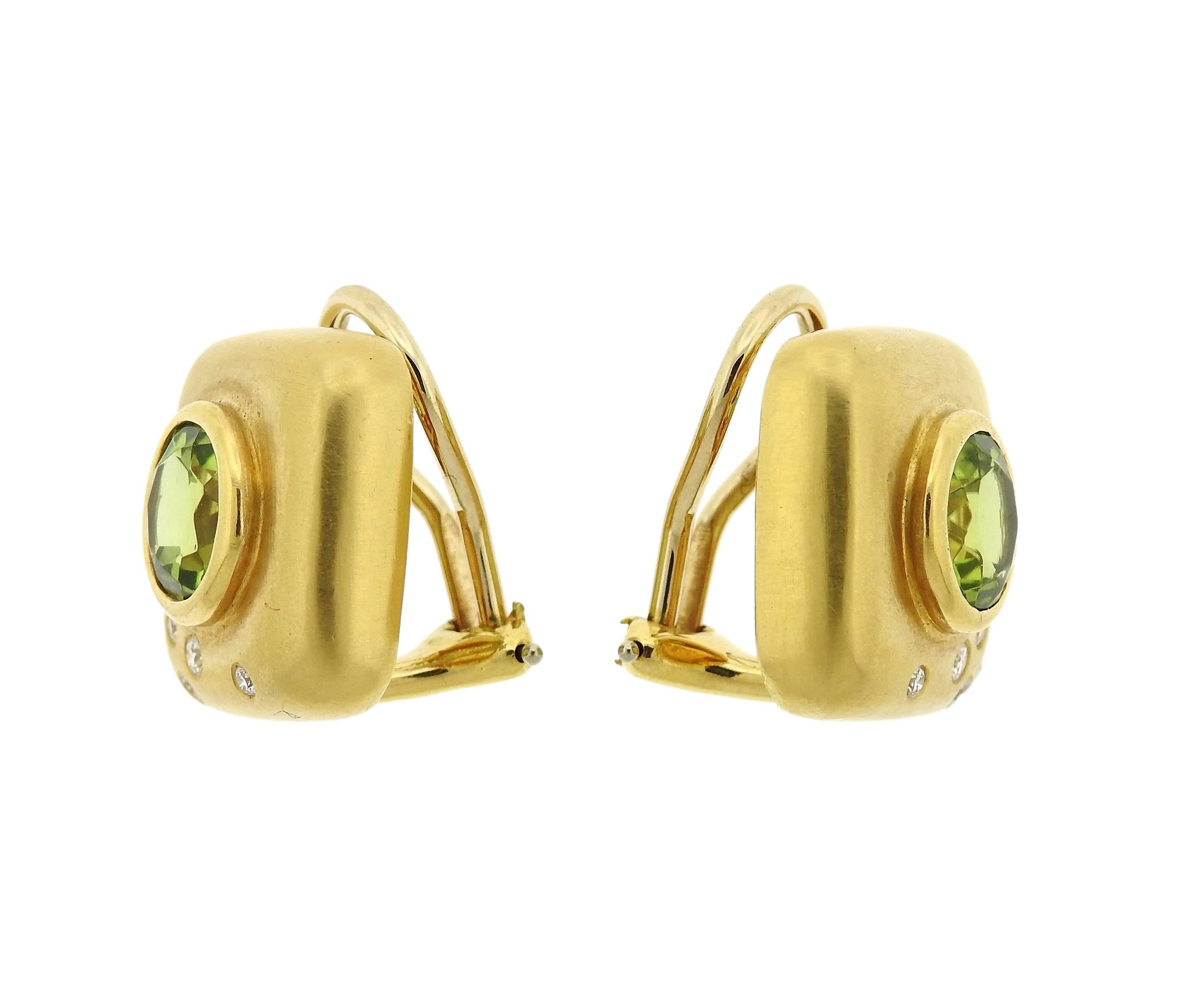 Pair of 18k yellow gold earrings, crafted by Angela Cummings in 1997, decorated with approx. 3.50ctw peridots and 0.20ctw G/VS diamonds . Earrings measure 15mm x 15mm. Marked: 1997, Cummings, 18k. Weight - 16.4 grams 