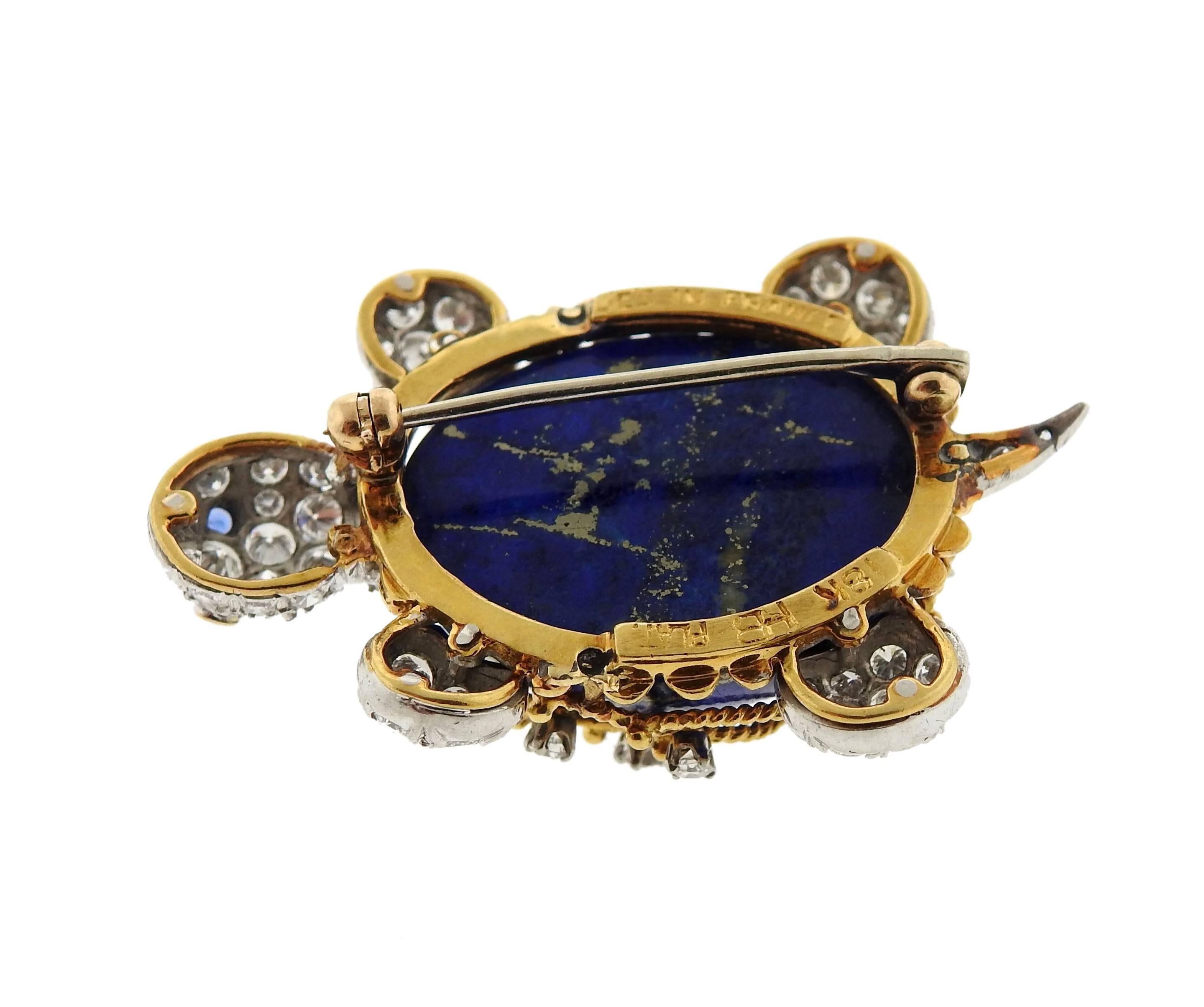 Platinum and 18k gold turtle brooch, crafted by Hammerman Bros, decorated with lapis, sapphire eyes and approximately 1.50ctw in diamonds. Brooch measures 40mm x 27mm. Marked: HB, plat, 18k, les in France. Weight - 17.6 grams 