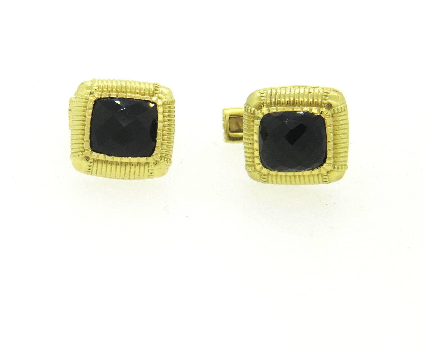 Pair of 18k yellow gold cufflinks, crafted by Judith Ripka, set with smokey quartz in the center. Each top measures 13mm x 14mm . Marked: Judith Ripka 18k. Weight - 15.1 grams 