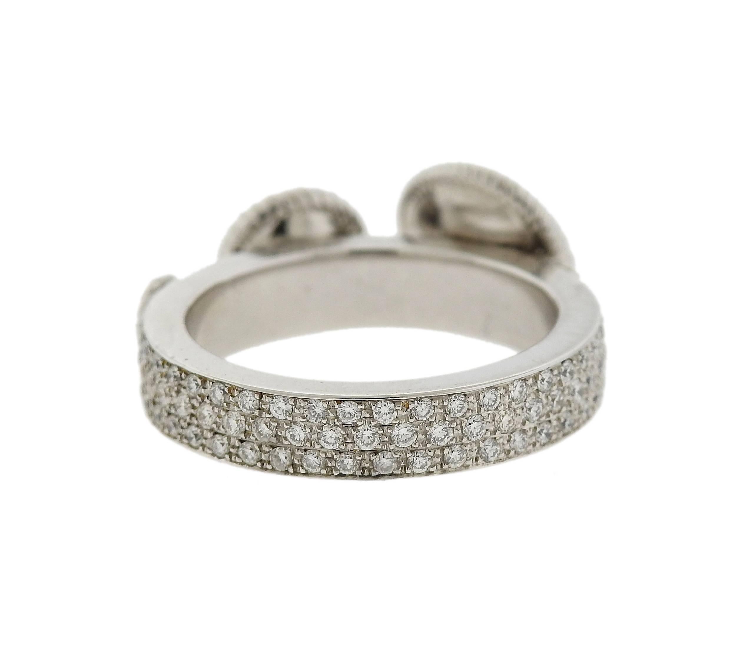 Lovely 18k white gold ring crafted by Carrera y Carrera for the Pasodoble collection. Featuring approximately 0.71ctw of FG/VS diamonds. Ring Size - 6.5, 9.7mm Widest Point (*top balls are movable and slide on the top*). Marked Carrera Y Carrera