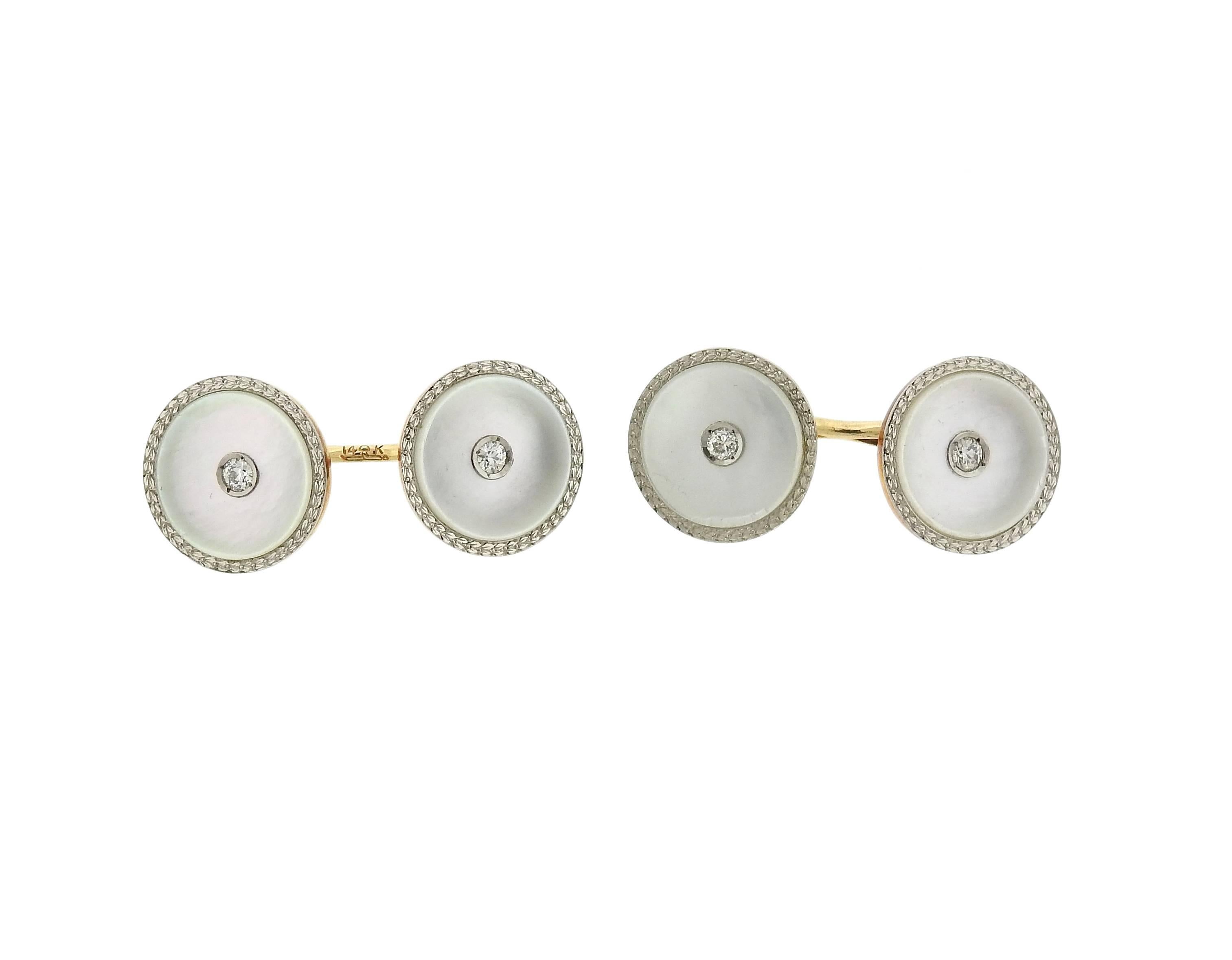 14k gold cufflinks and stud set, crafted by circa 1920s, decorated with mother of pearl tops and approx. 0.50ctw in diamonds. Cufflink top is 14mm in diameter, small stud top - 8mm in diameter. Marked: 14k. Weight - 18 grams 