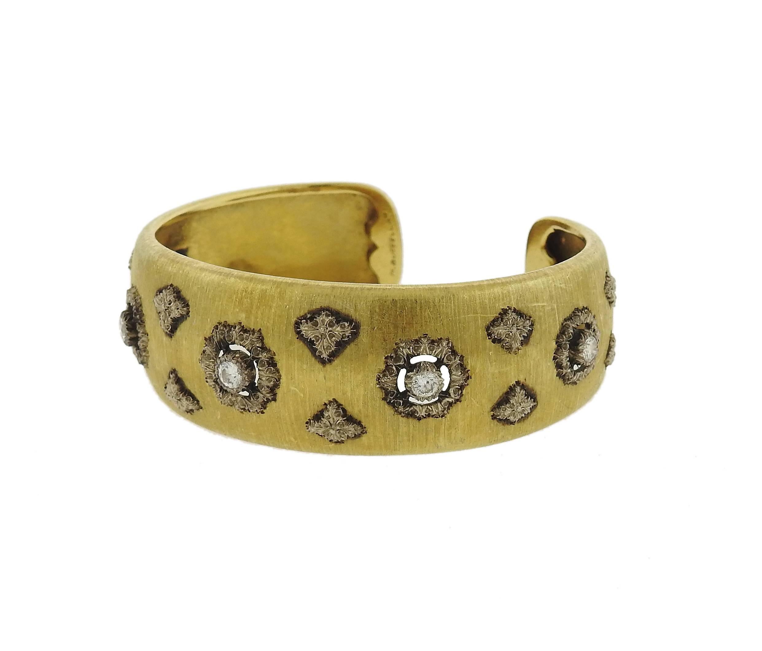 Magnificent 18K gold cuff bracelet decorated with approximately 0.72ctw of diamonds by Mario Buccellati. Cuff measures 22mm wide and will fit up to a 6.5