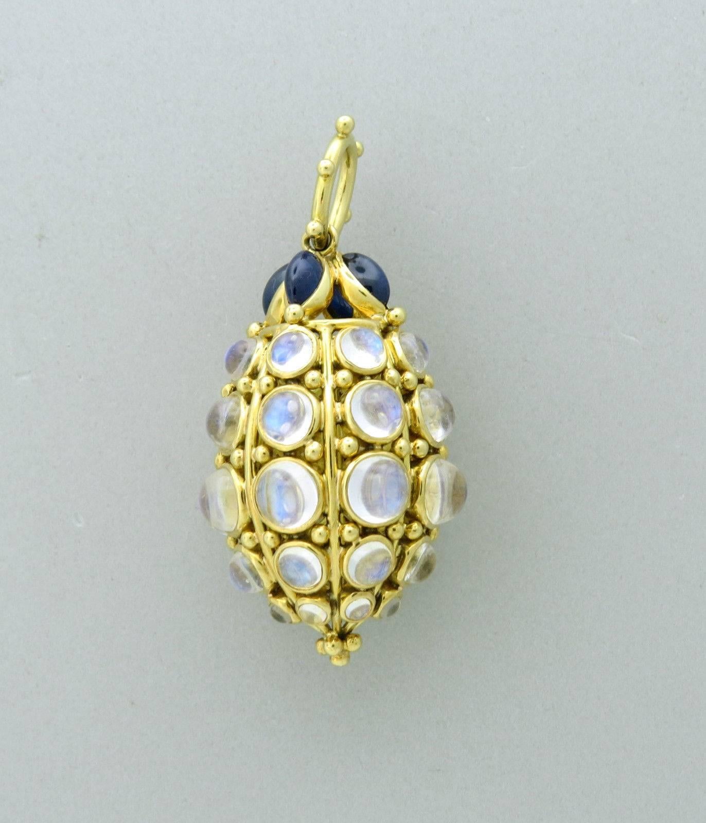 Large 18k gold pendant amulet , crafted by Temple St. Clair, featuring bee hive design. Pendant is  2 1/4" long x is 1 1/8" in diameter. Decorated with 26.72ctw in blue moonstones and 3.20ctw in sapphires. Marked with Temple mark and 750.