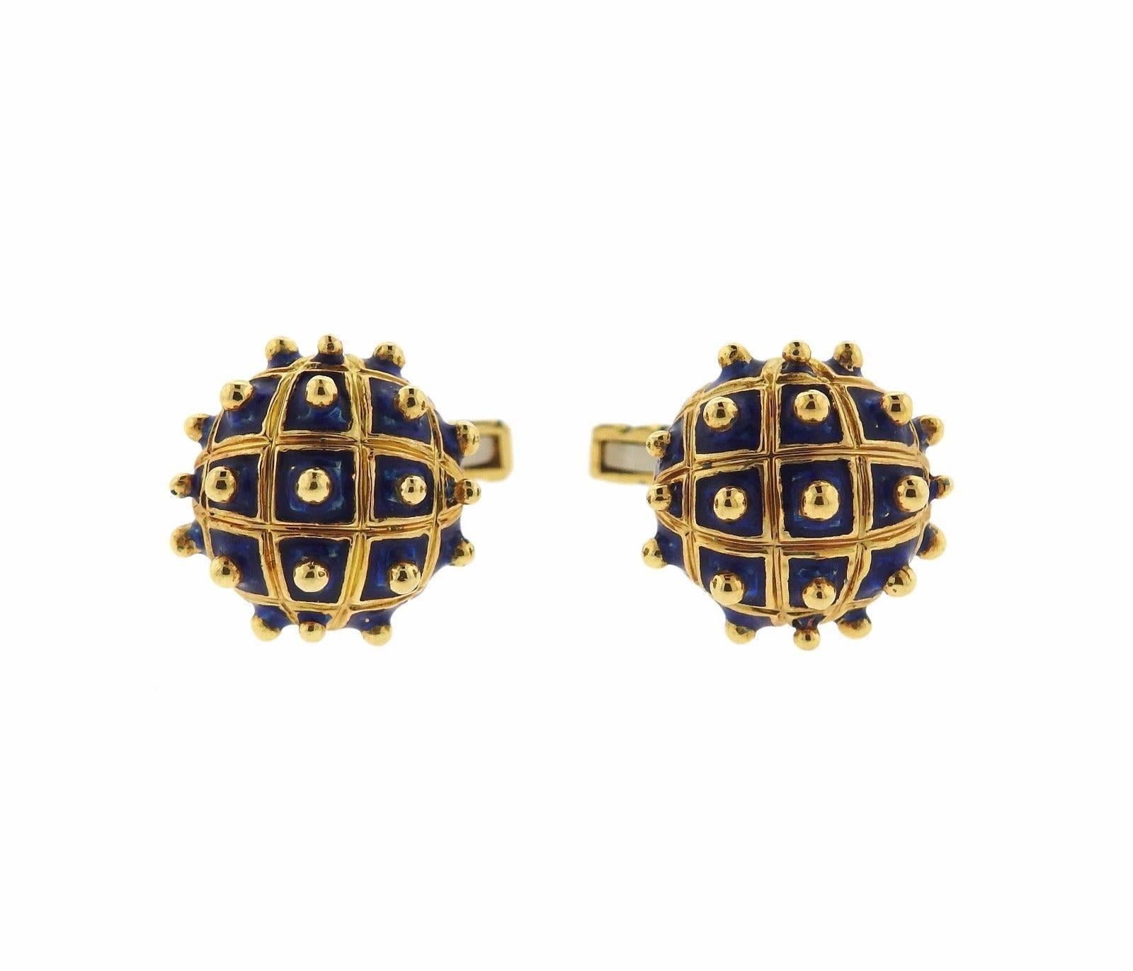 A pair of 18k gold cufflinks adorned with blue enamel.  Crafted by David Webb, the cufflinks are 18mm in diameter and weigh 18.9 grams.  Marked: Webb, 18k.