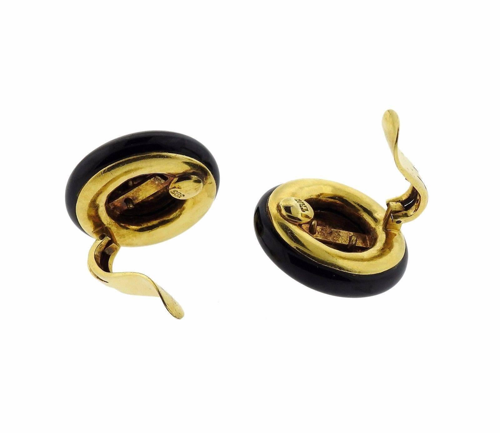 A pair of 14k yellow gold earrings set with onyx.  Crafted by Trio, the earrings measure 25mm in diameter and weigh 32 grams.  Marked: 585, Trio.