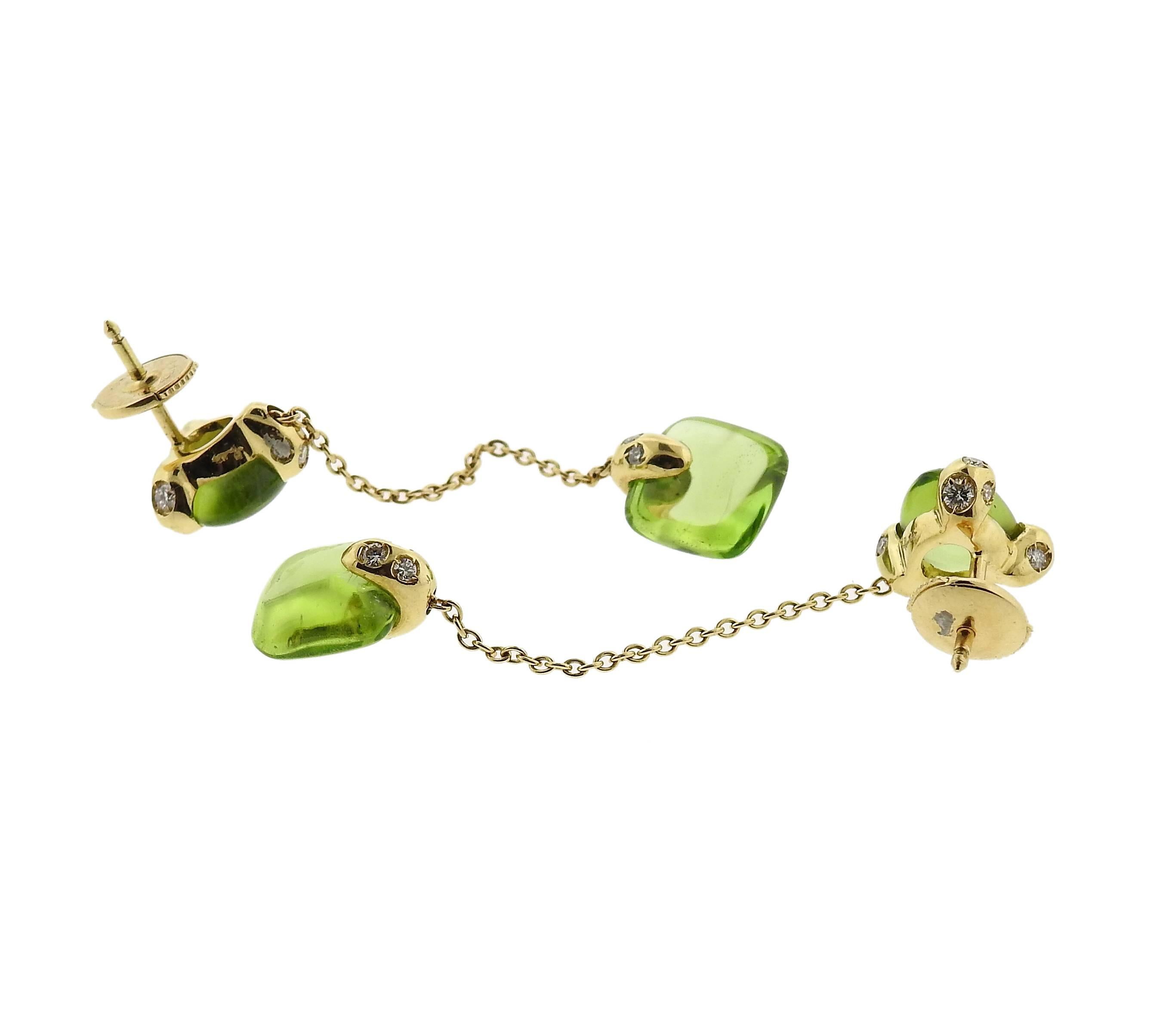 Lovely 18k Gold earrings featuring peridot and diamonds. Crafted by Pomellato for the Sassi collection. Earrings measure 53mm long X 10mm wide. Marked Pomellato 750. Weight is 8.9 grams. 