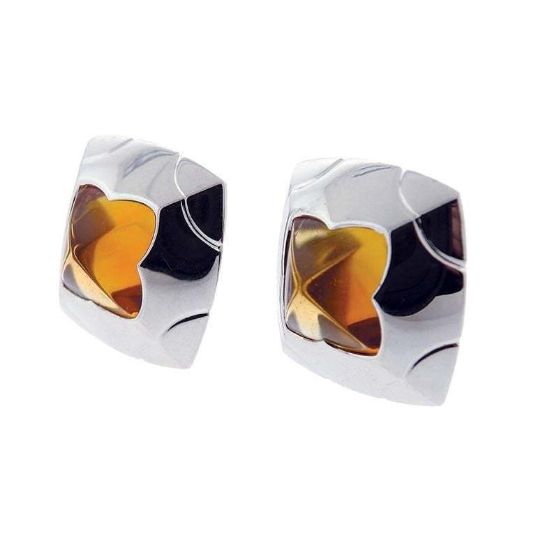 A pair of 18k white gold earrings set with citrine from the Piramide collection by Bulgari. The earrings measure 25mm x 25mm and weigh 31.0 grams.