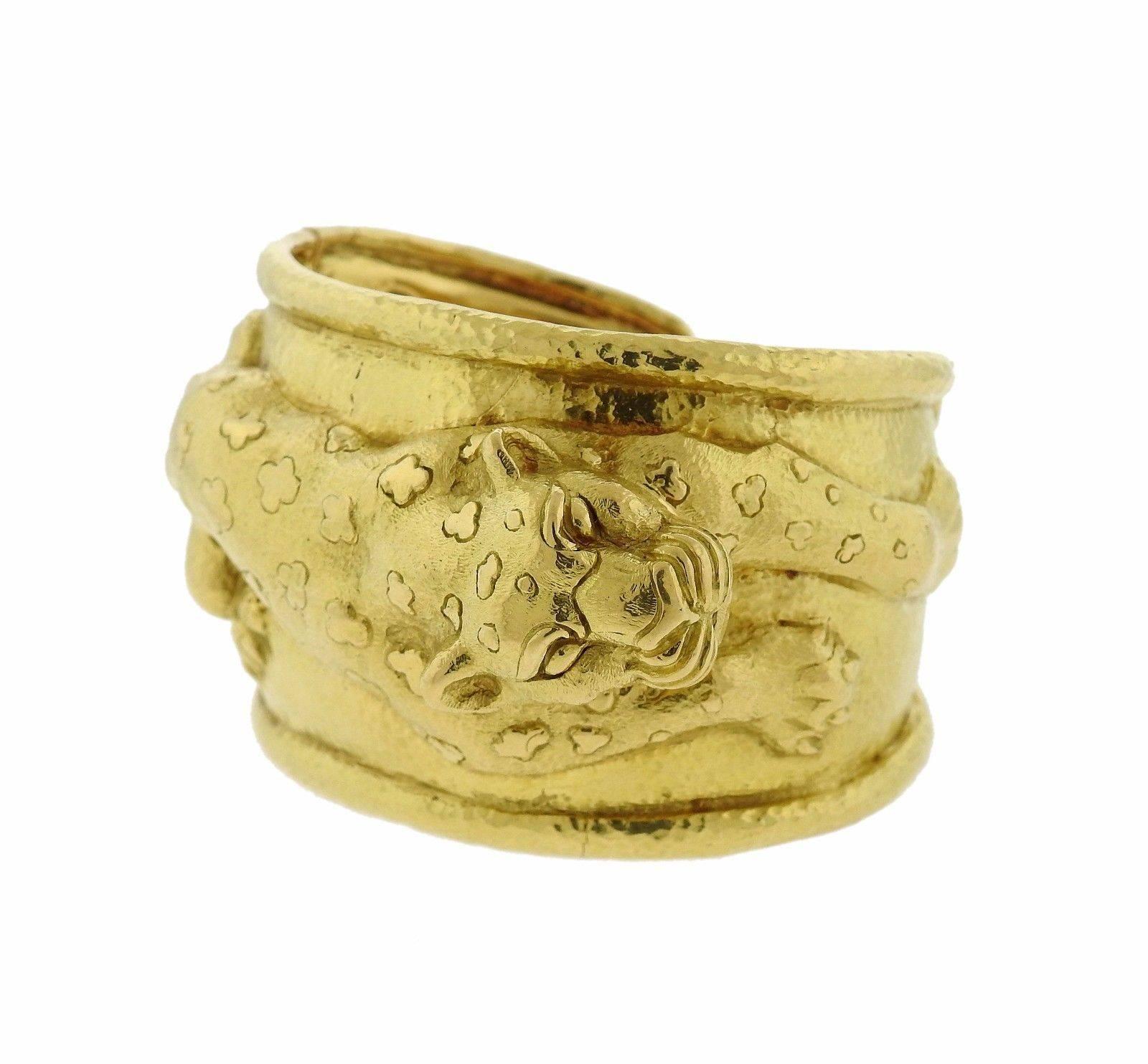 An 18k yellow gold bracelet depicting a leopard.  The bracelet will fit up to 7 1/2