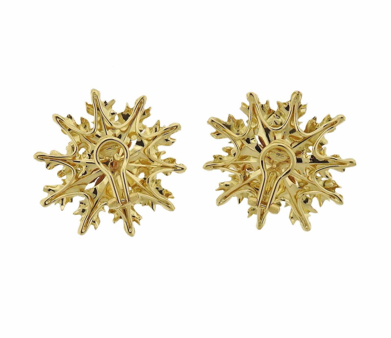 A pair of 18k gold flower earrings.  The earrings measure 36mm x 37mm and weigh 19.8 grams.  Marked: Italy, 18k, Buccellati.  The earrings come with Buccellati paperwork.  The retail price for this pair is $15420.