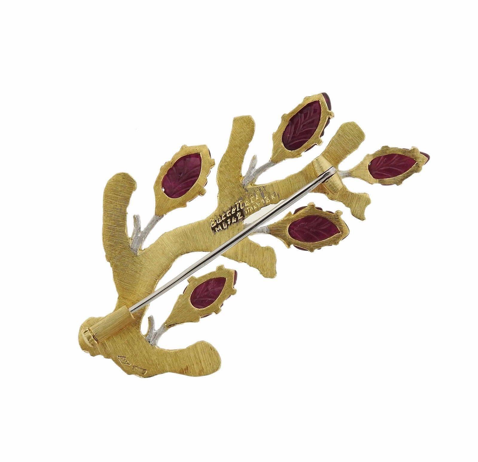 An 18k gold brooch pin set with 5.24ctw of carved rubies.  The brooch measures 54mm x 32mm and weighs 13.6 grams.  Marked: 750, ML742, Italy, 18k, Buccellati. Comes with Buccellati paperwork . Retail $18230.