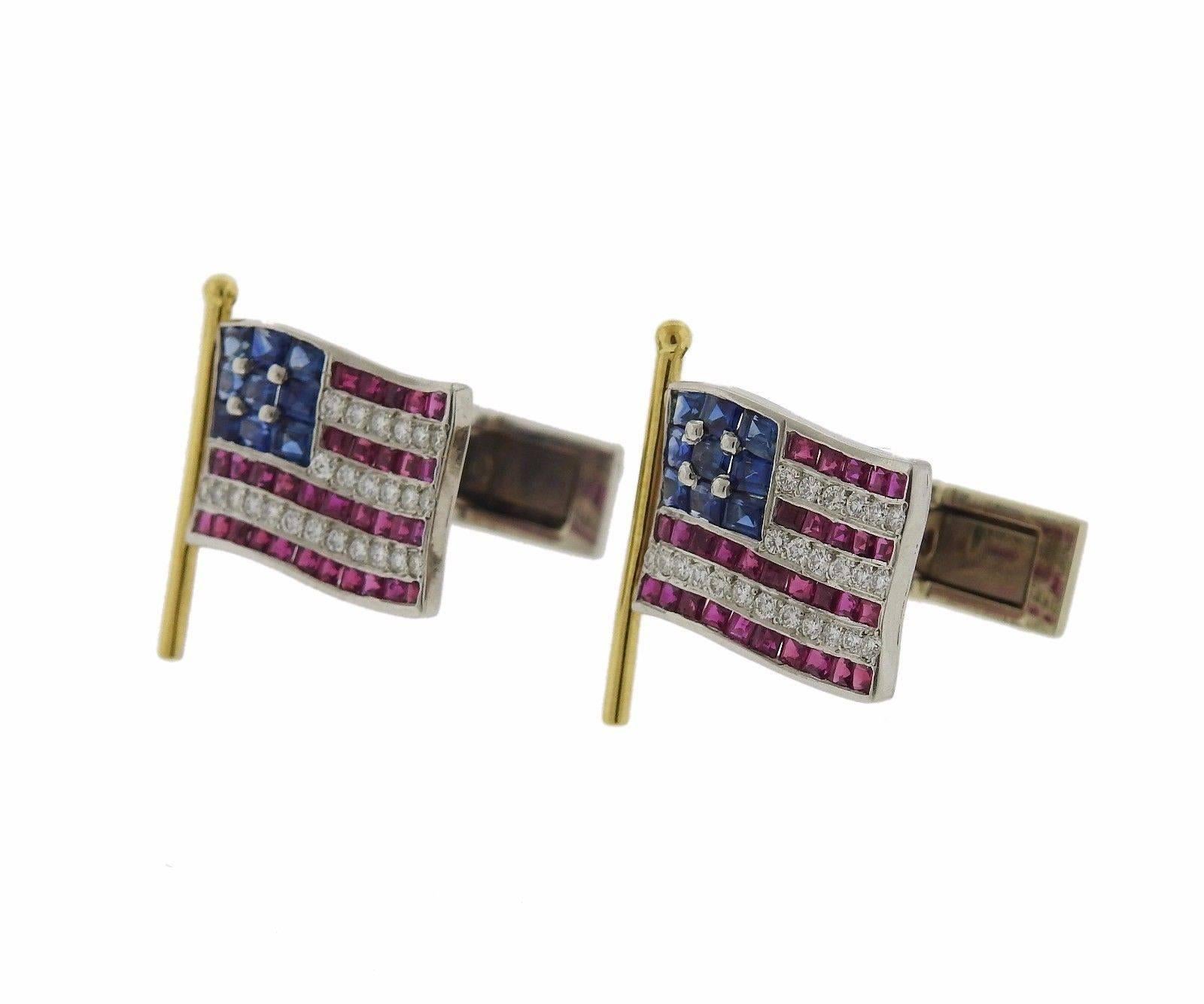 A pair of 18k gold and platinum cufflinks set with sapphires, rubies and approximately 0.40ctw of H/VS-SI diamonds.  The cufflinks measure 21mm x 17mm and weigh 13.4 grams.  Marked: 18k , tested plat.