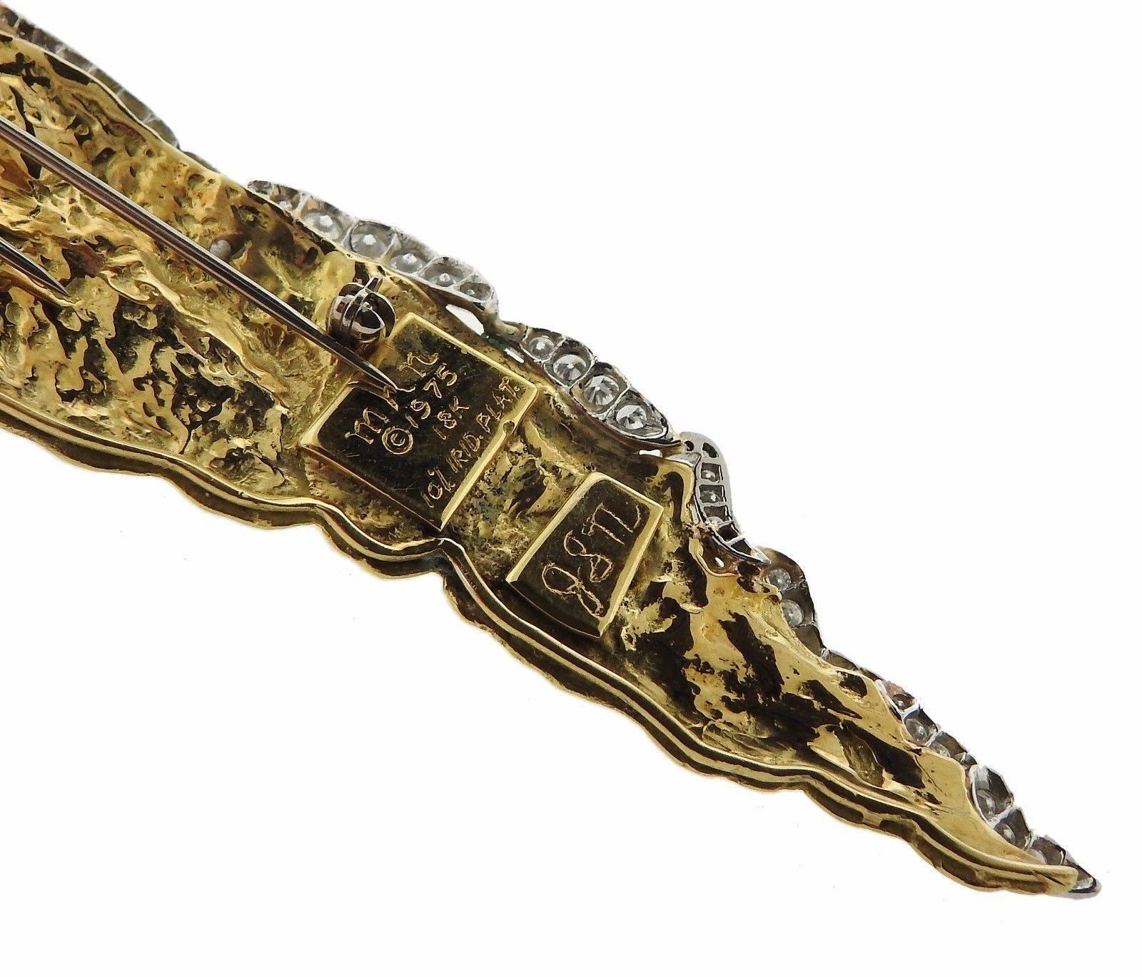 An 18k yellow gold and platinum brooch set with 4.40ctw of G/VS diamonds.  The brooch is 132mm x 28mm and weighs 36.3 grams. Marked: MHN,1975, 18k, 10% irid. plat.