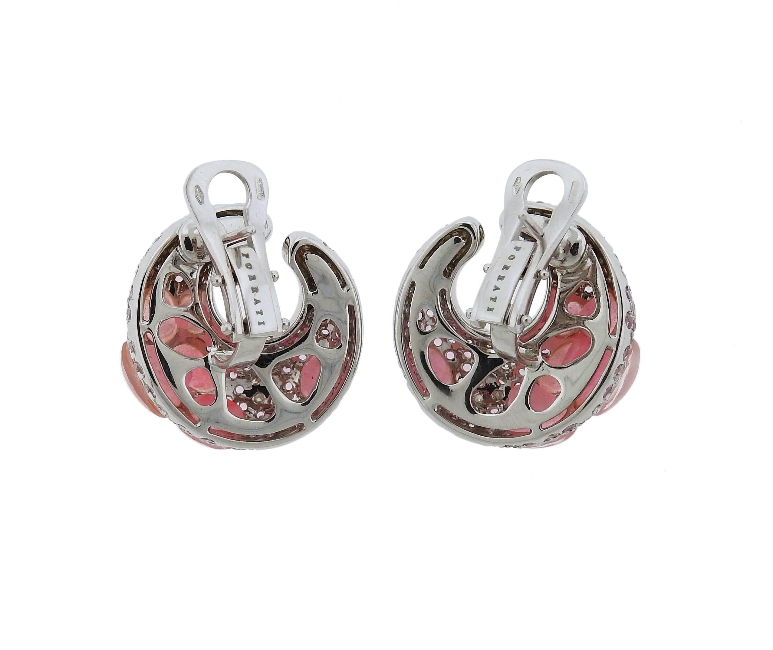 A pair of 18k white gold earrings set with pink sapphires and approximately 1 carat of G/VS diamonds.  The earrings measure 23mm x 23mm and weigh 22.1 grams.  Marked: Porrati, 750, Italian mark.