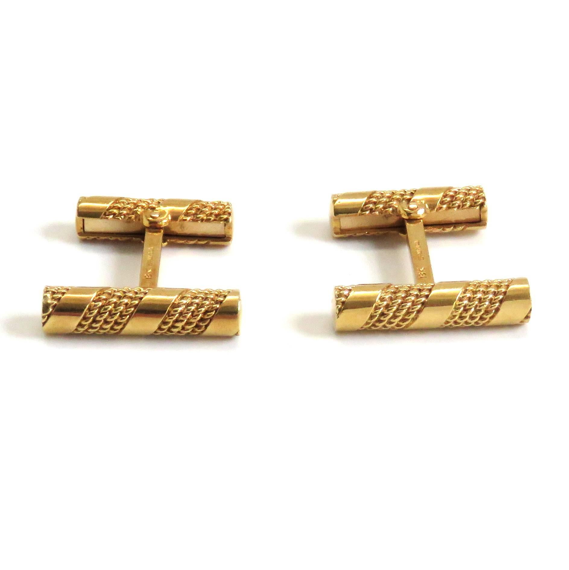 A pair of 18k yellow gold cufflinks by Tiffany & Co.  The cufflinks measure 25mm x 5.5mm and weigh 20.5 grams. Marked: Tiffany & Co, 18k.