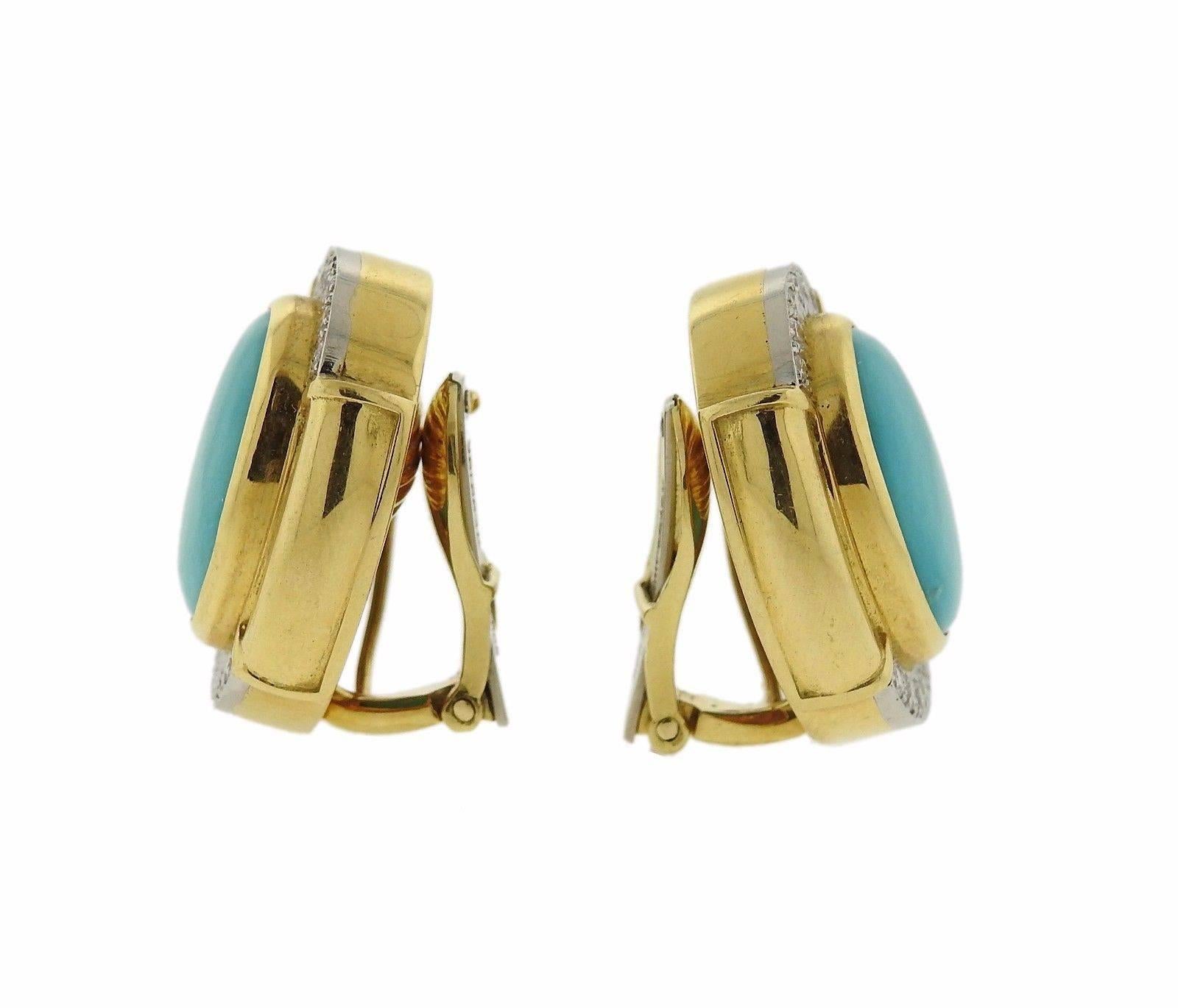 A pair of 18k gold and platinum earrings set with turquoise (16mm x 12mm) and approximately 0.48ctw of H/VS diamonds.  The earrings measure 25mm x 20mm and weigh 30.3 grams.  Marked: 900pt, 18k, Webb.