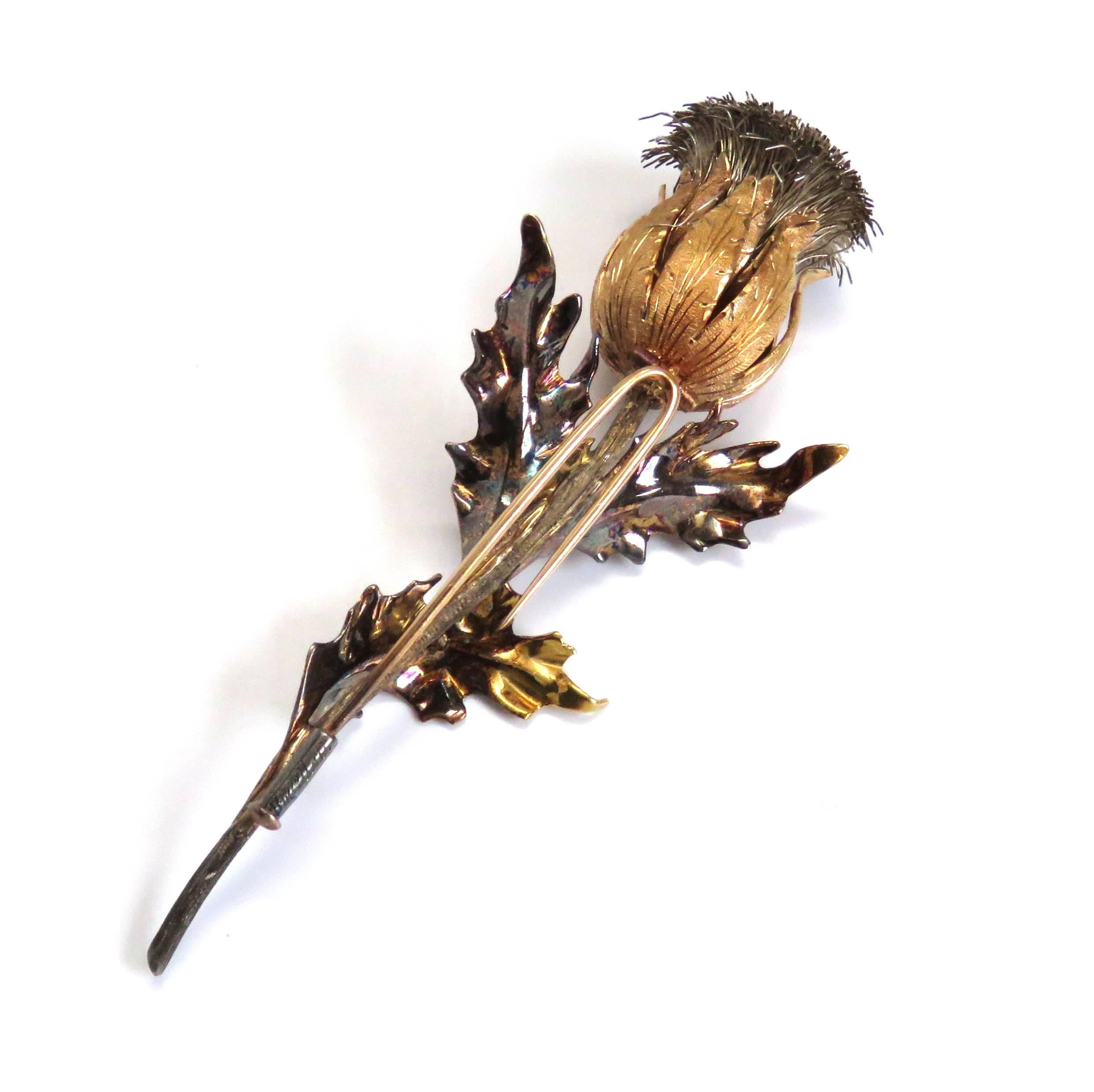 An 18k white yellow and rose gold brooch by Buccellati.  The brooch measures 86mm x 33mm and weighs 21.8 grams.  Marked: Buccellati, 18k, 16100.