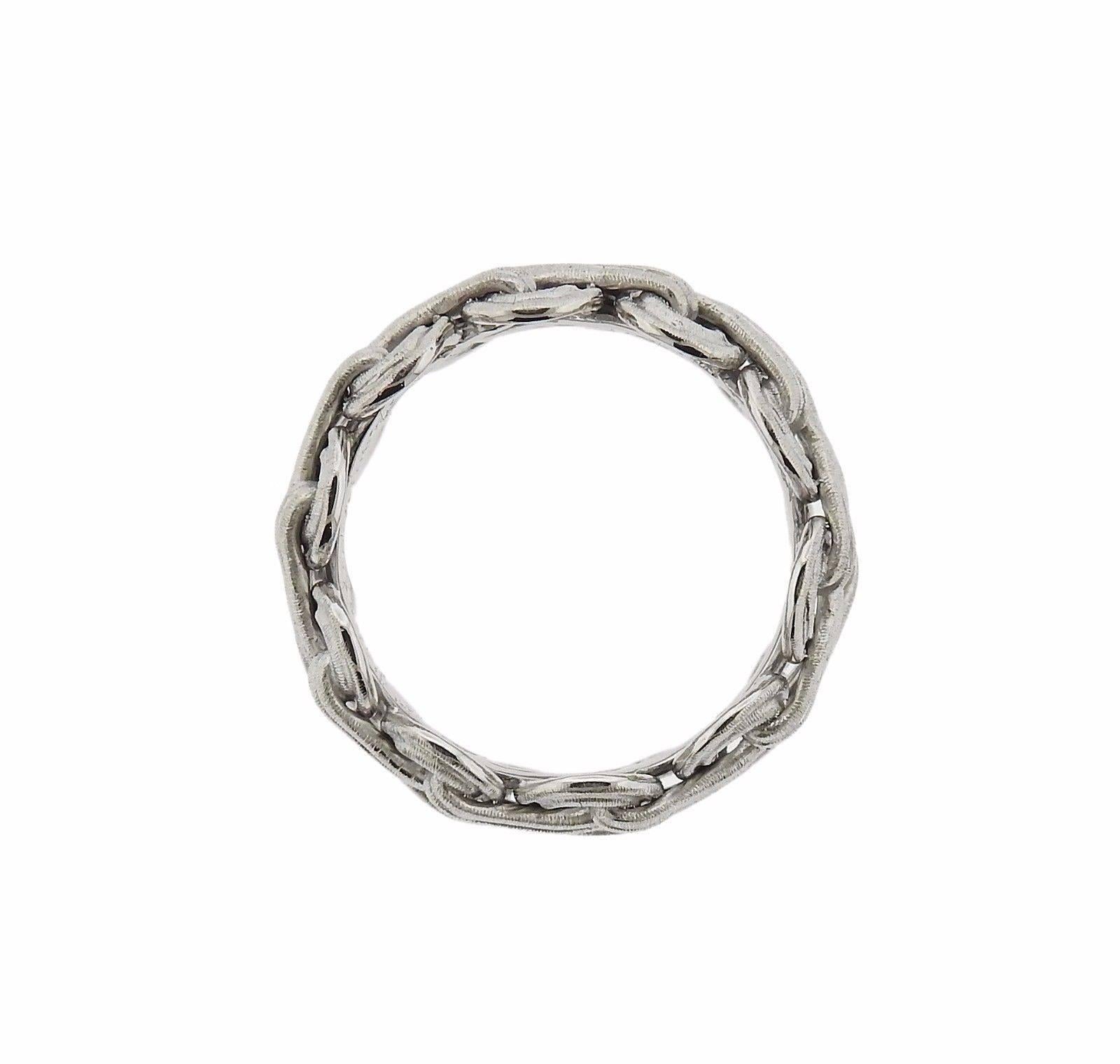 An 18k white gold band ring by Gianmaria Buccellati.  The ring is a size 5 1/2 and is 9mm wide.  The weight of the piece is 6.9 grams.  Marked: Gianmaria Buccellati, 18k, Italy.  Retail $3280 With Original Paperwork.