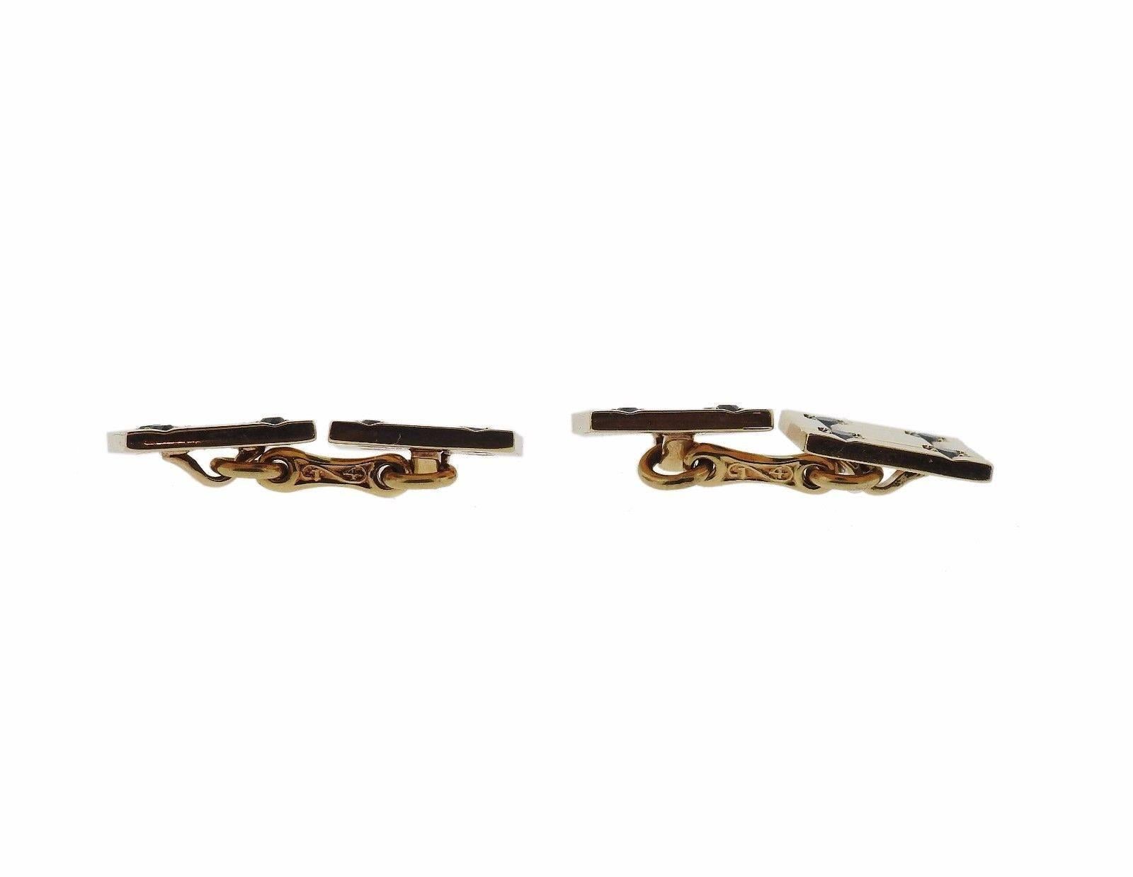 A pair of 14k yellow gold cufflinks set with sapphires.  The cufflinks measure 12.5mm x 12.5mm and weigh 13.7 grams.  Marked: 14k, Tiffany & Co.