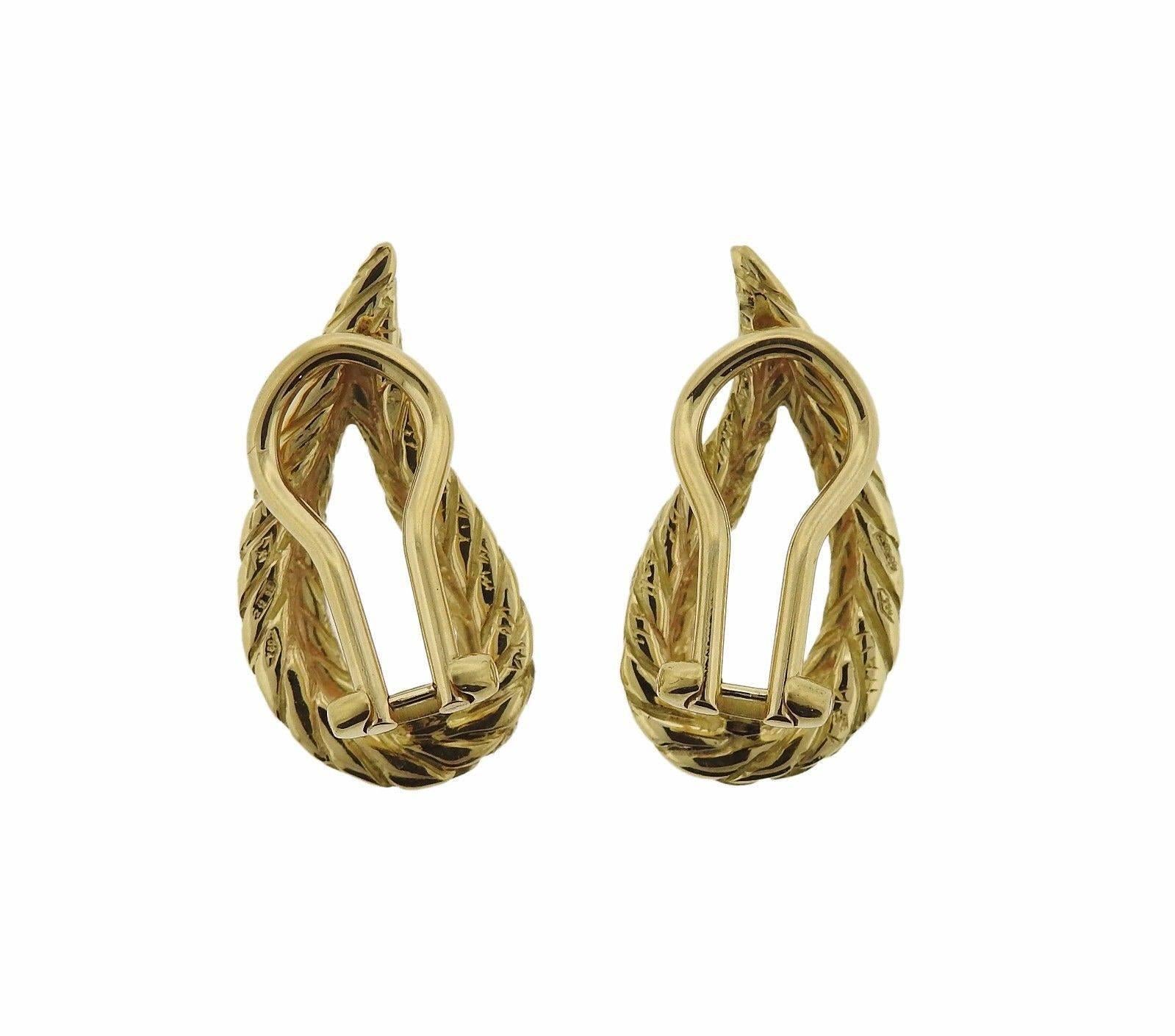 A pair of 18k gold earrings by Buccellati.  The earrings measure 23.2mm x 12.2mm and weigh 8.2 grams.  Marked: 750, Italy,  18k, Buccellati.  The earrings retail for $2950 and come with paperwork from Buccellati.