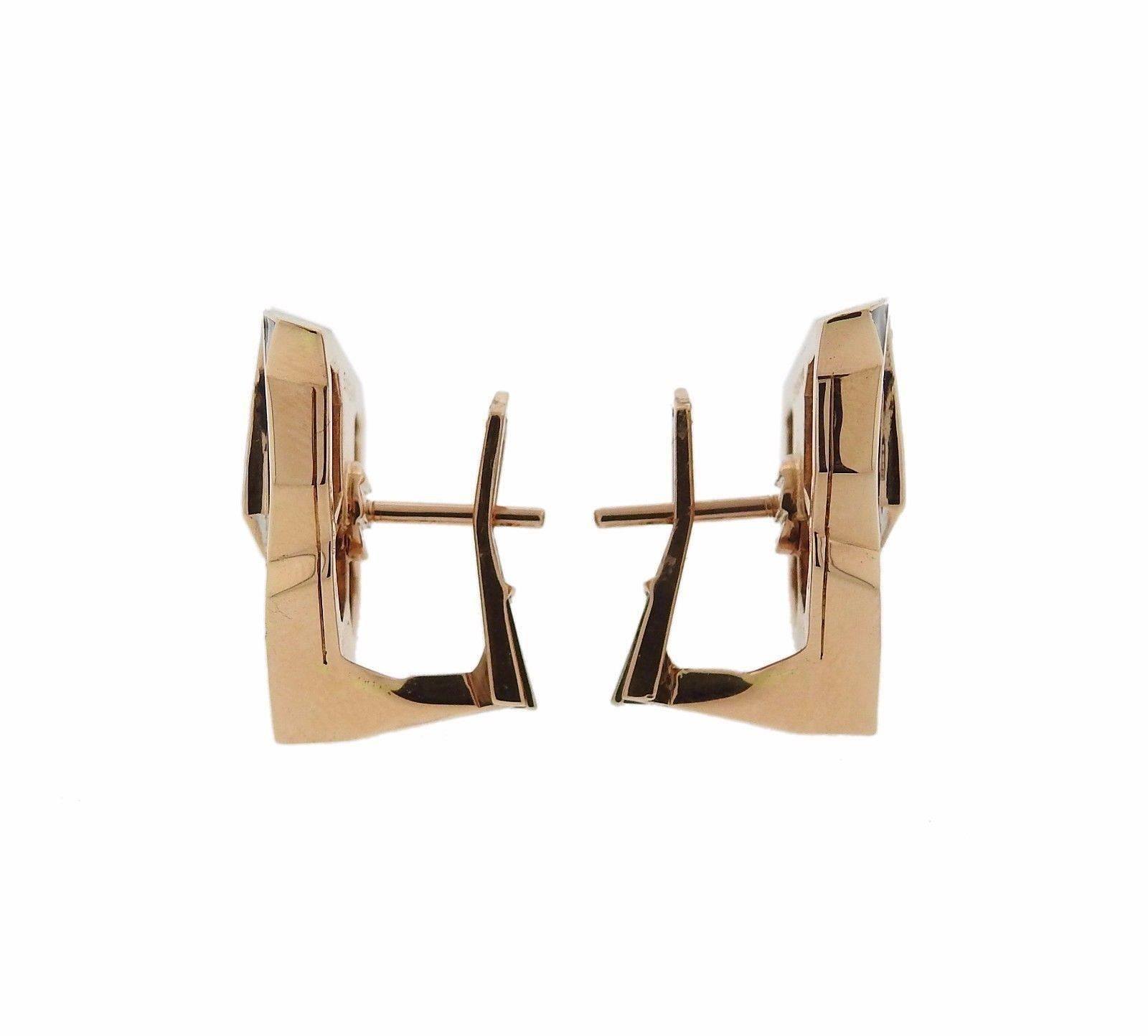A pair of 18k rose gold diamond panther earrings by Gianni Bulgari.  The earrings are set with approximately 1.08ctw of G/VS diamonds, and they measure 27mm x 27mm.  The weight of the pair is 23.8 grams.  Marked: Enigma, made in Italy, 750.  The