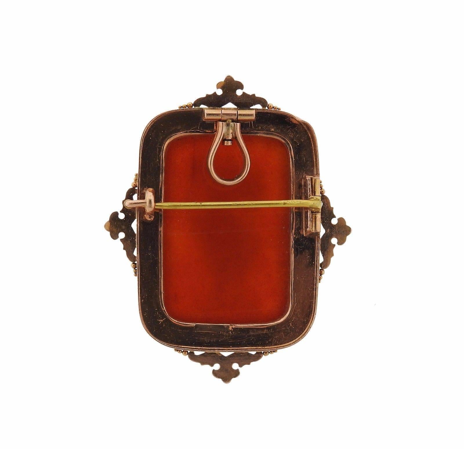 A 14k rose gold hardstone cameo brooch pendant.  The piece measures 46mm x 36mm and weighs 16.5 grams. 