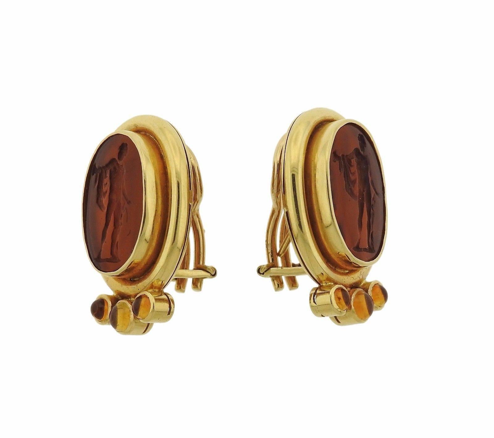 A pair of 18k gold earrings set with citrines and Venetian glass intaglio.  The earrings are 27mm x 17mm and weigh 17.3 grams.  Marked: 18k Locke mark.