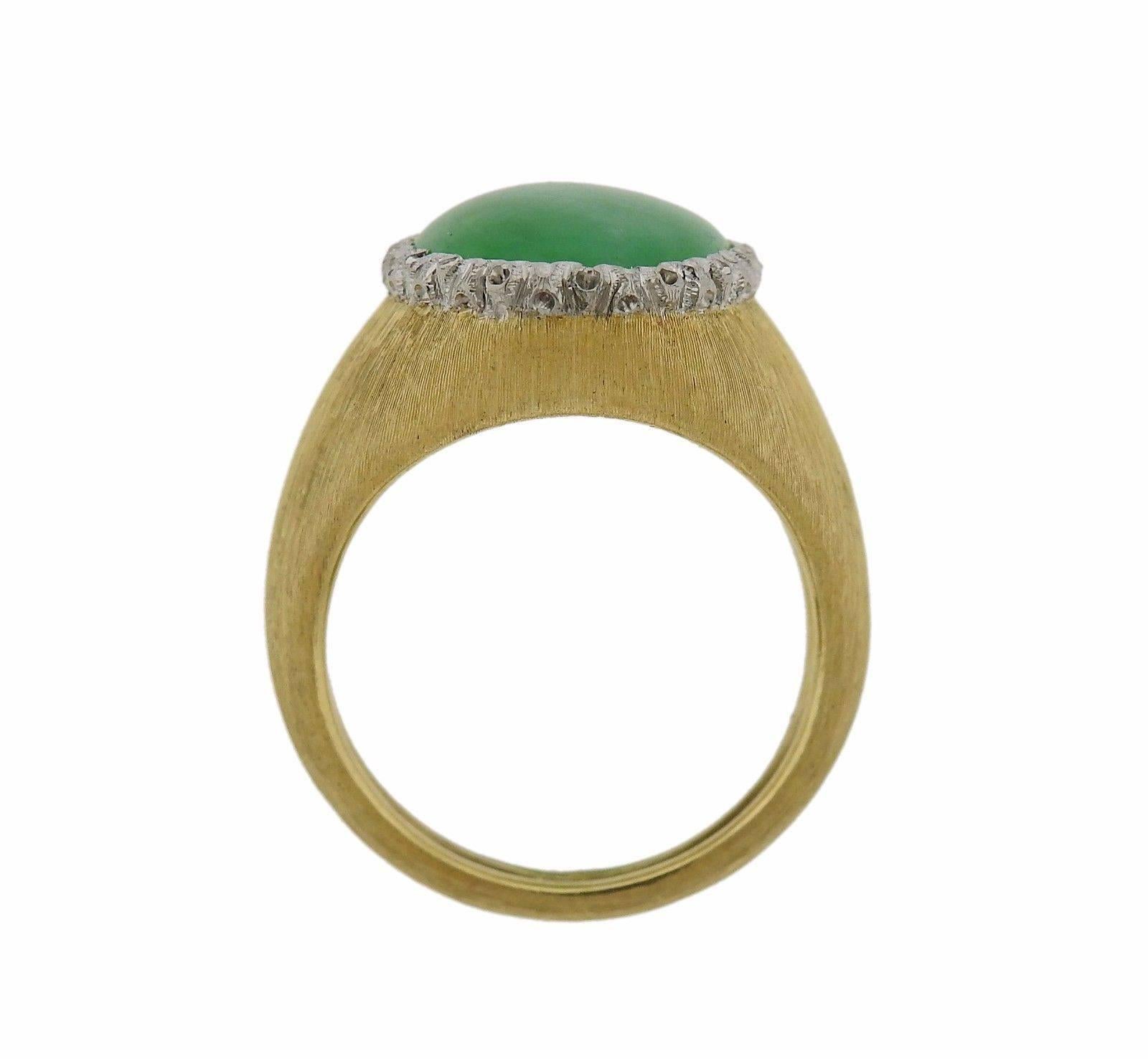 An 18k yellow gold ring set with Jade (16mm x 11.8mm).  The ring is a size 6 1/2 and the top is 17mm wide. The weight of the piece is 8.6 grams. Marked: Buccellati, 750.