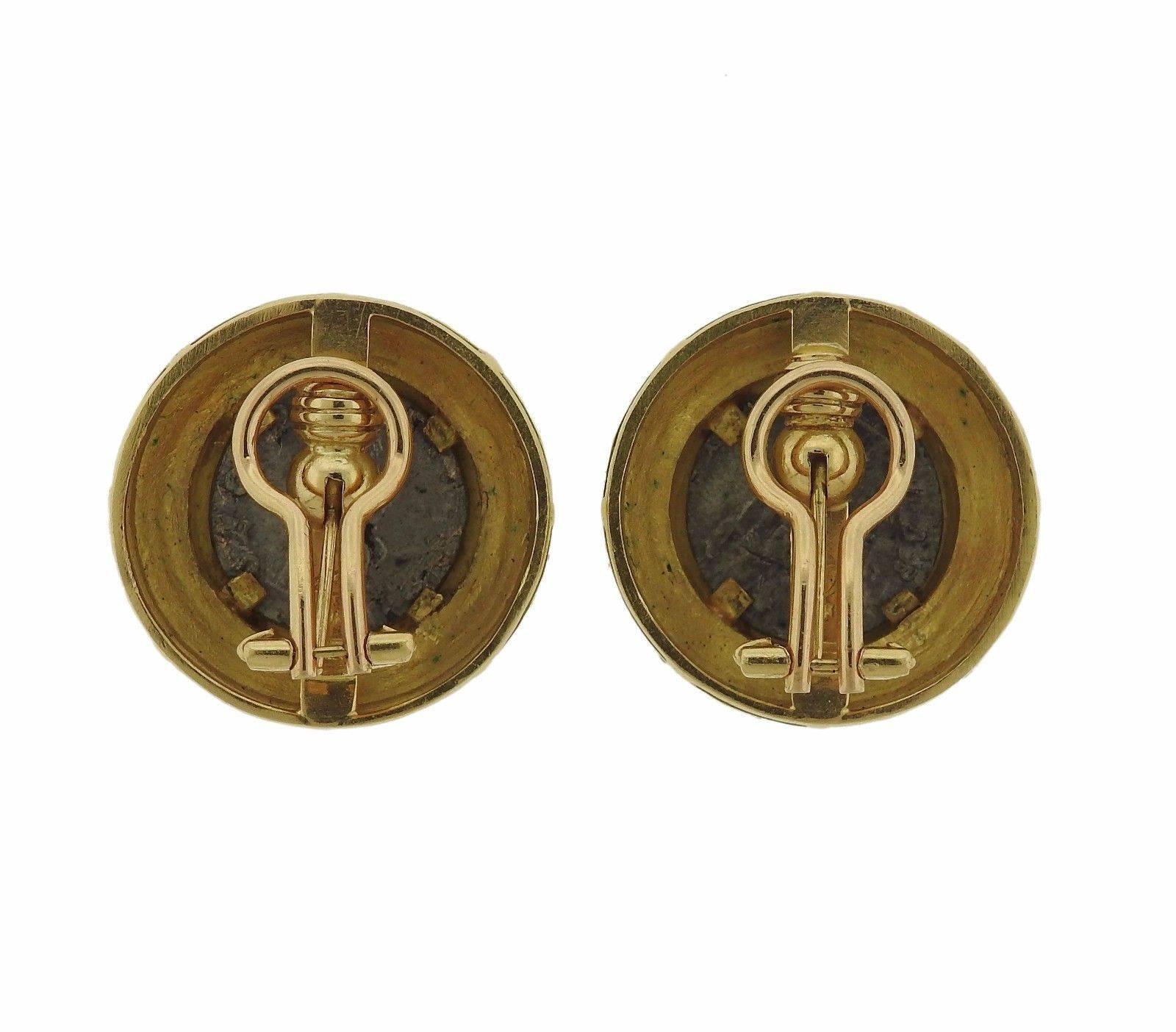 A pair of 19k gold earrings set with 14.5mm coins.  The earrings measure 26mm in diameter and weigh 28.9 grams.  Marked: 19k, Locke Hallmark.