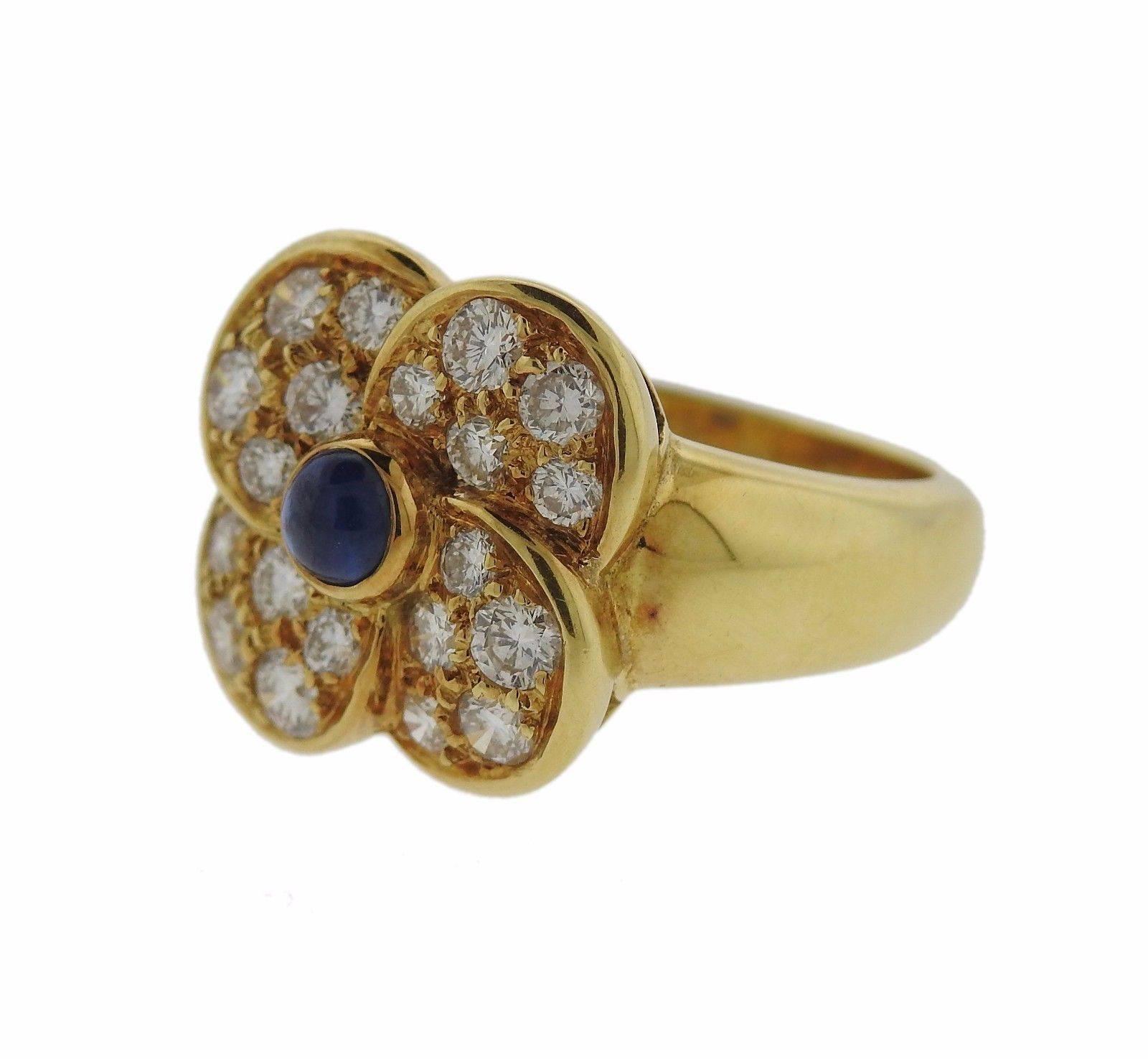 An 18k gold ring set with sapphires and approximately 1 carat of G/VS diamonds.  The ring is a size 6 1/2, the ring top is 15mm x 15mm.  The weight of the piece is 9 grams.  Marked: Dior, 3 OR 750.