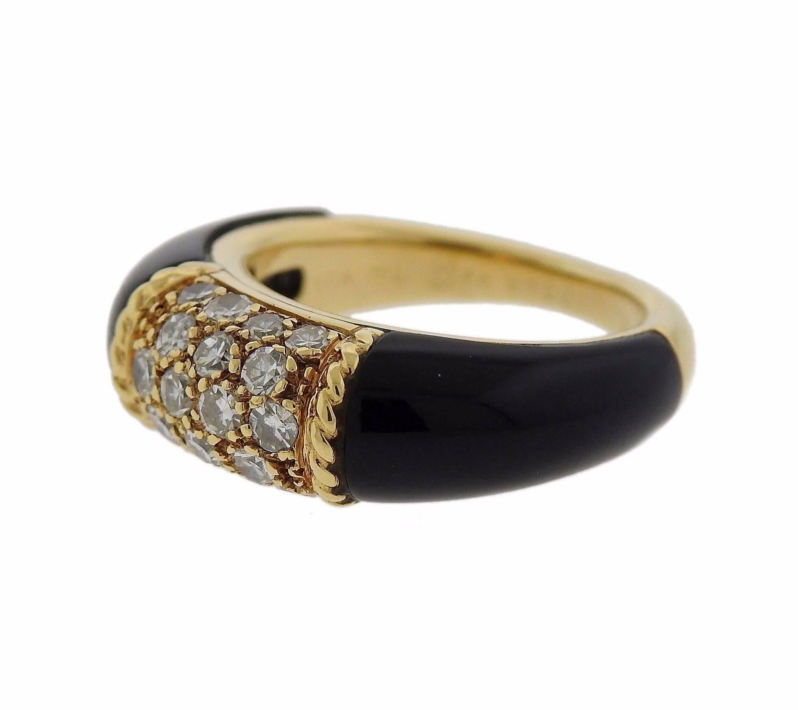 An 18k gold ring set with onyx and approximately 0.42ctw of F-G/VS diamonds.  The ring is a size 4 and is 6.6mm wide.  Marked:	VCA, 750, 68 B3001, x528.  The weight of the ring is 6.3 grams.