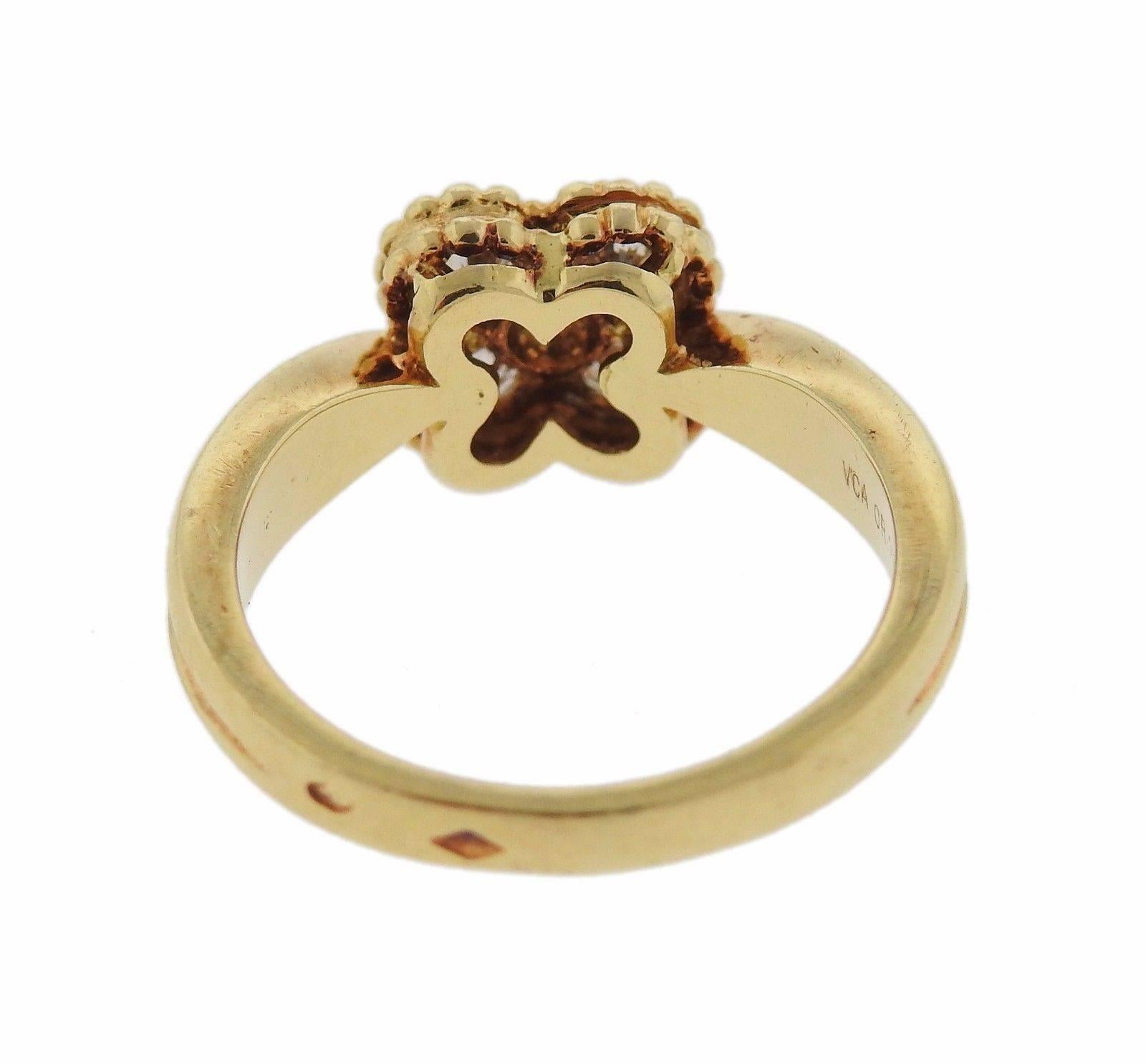 An 18k gold ring set with 0.24ctw of F-G/VVS diamonds.  The ring is a size 5 and the clover measures 8.1mm x 8.2mm.  The weight of the ring is 4.5 grams.  Marked: VCA, OR 750, B5960, A102.