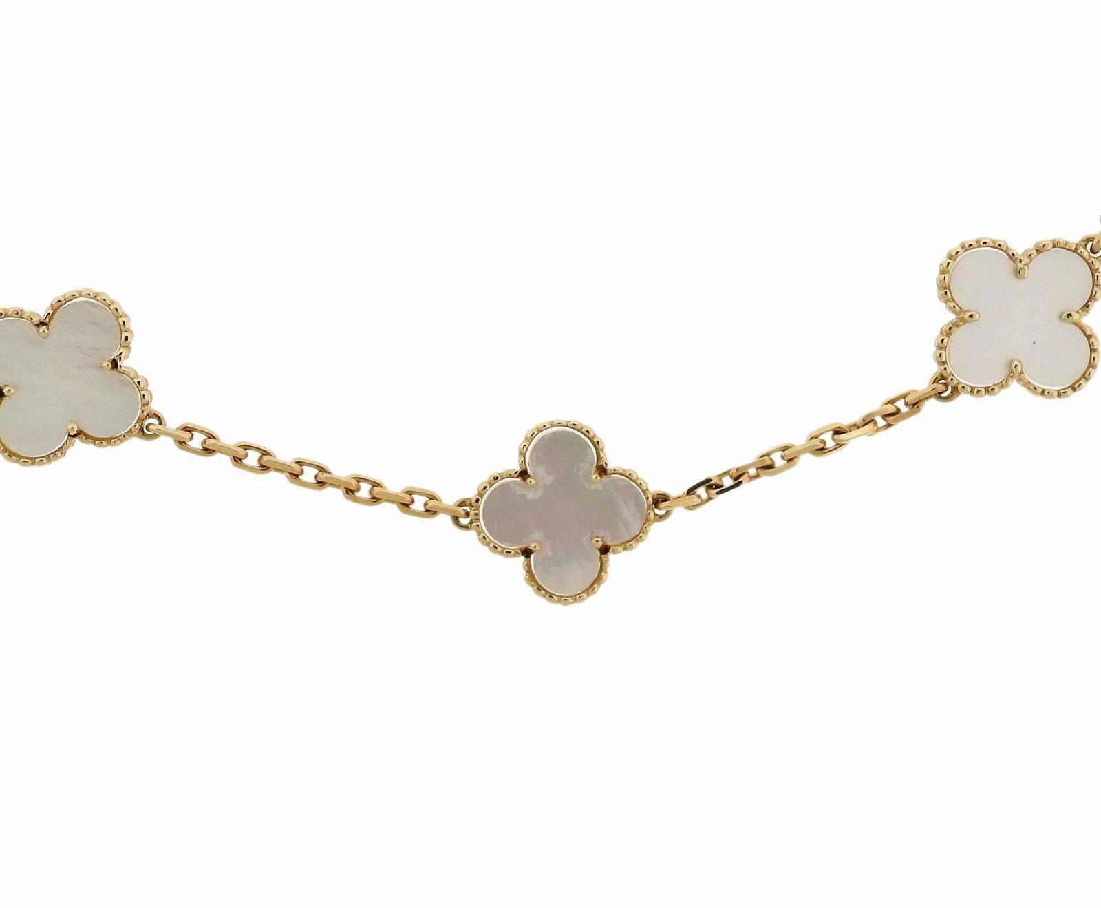 An 18k yellow gold necklace set with mother of pearl.  The necklace is 16 1/2" long and the clovers measure 14.5mm x 14.5mm.  Marked:	VCA 750, CL24819.  The weight of the piece is 21.4 grams.
Comes with pouch and copy of receipt.