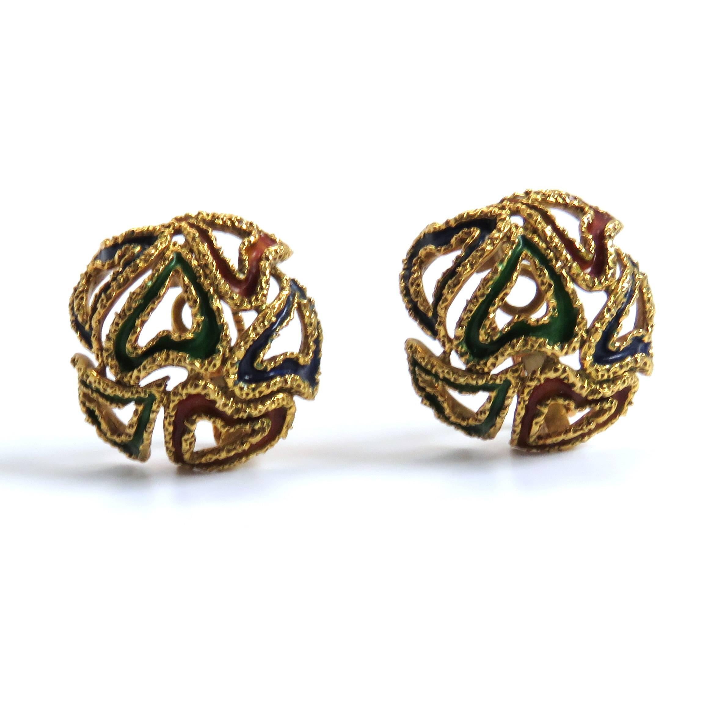 A pair of 18k yellow gold earrings adorned with blue, green and brown enamel.  The earrings measure 24mm in diameter and weigh 17.8 grams.  Marked: Hermes Paris.
