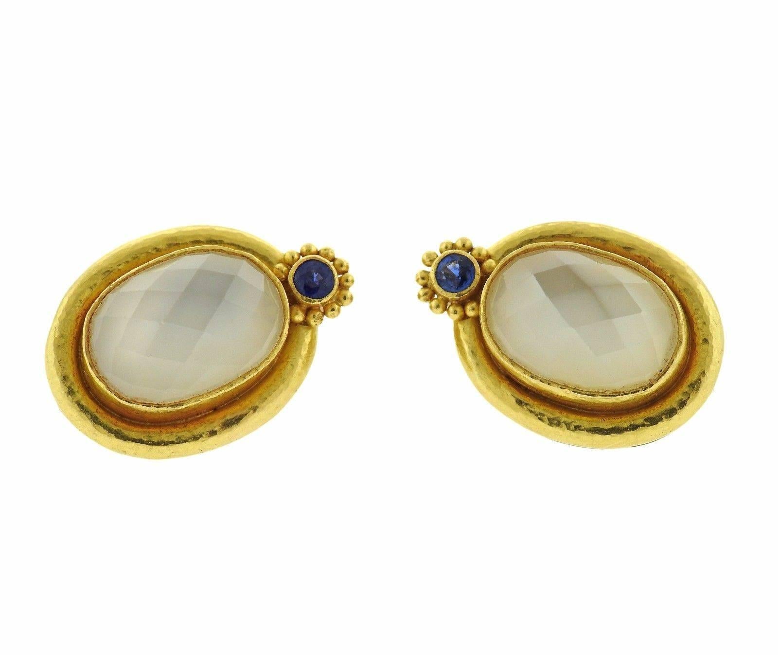 A pair of 18k gold earrings set with faceted moonstone and sapphires.  The earrings measure 25mm x 17mm and weigh 17.8 grams.  Marked: 18k, Locke mark.