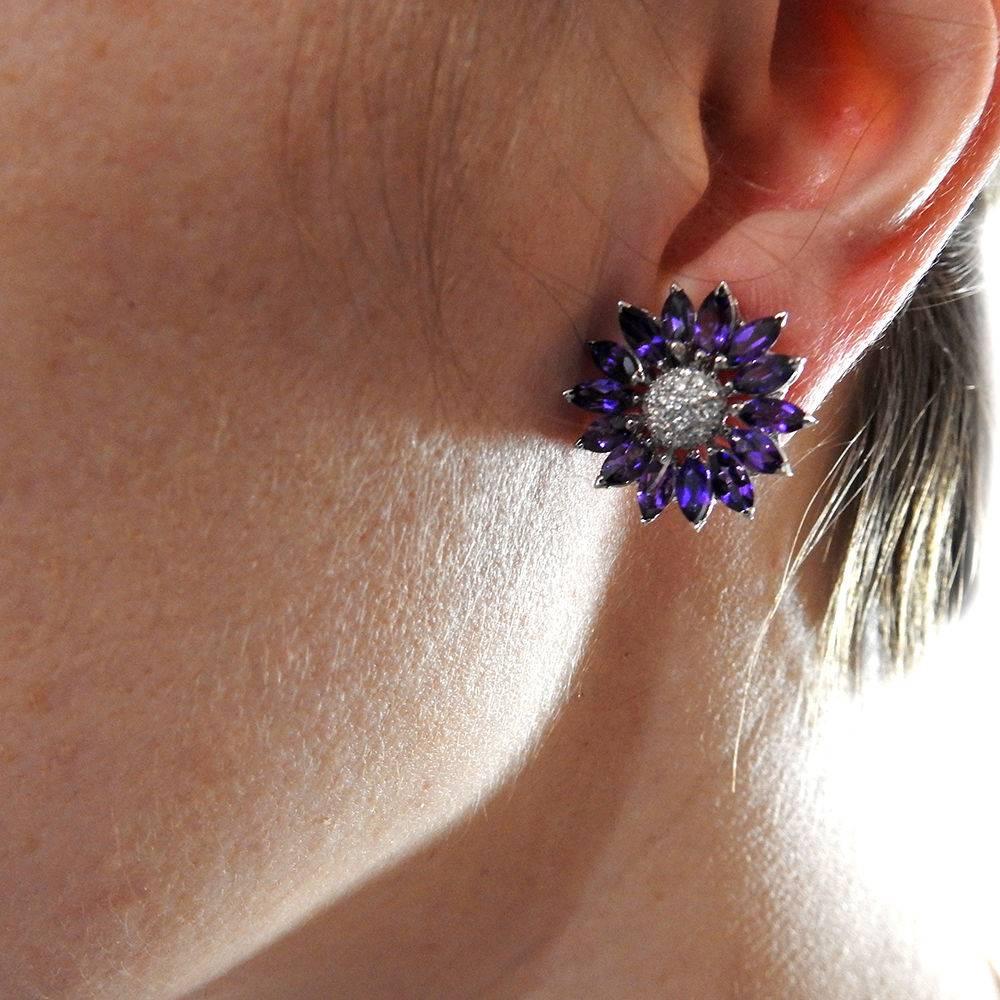A pair of 18k white gold earrings set with amethyst and approximately 0.19ctw of G/VS diamonds.  The earrings measure 20mm in diameter and weigh 13.6 grams.  Marked: Asprey, 18Kt, gold mark.  Come with copy of the sales receipt from 1999 for $4350.
