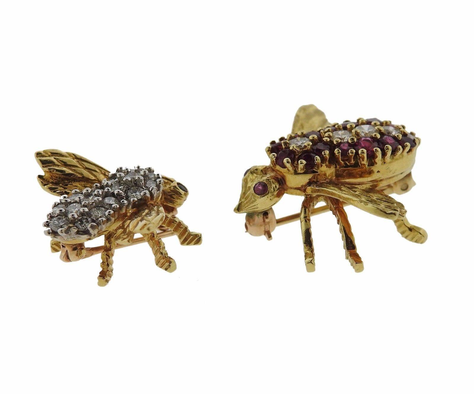 A pair of 18k gold brooches set with approximately 0.50ctw of H/VS diamonds and rubies.  The brooches measure 21mm x 25mm and 18mm x 20mm.  The weight of the set is 10.6 grams.  Marked: HR 18k.